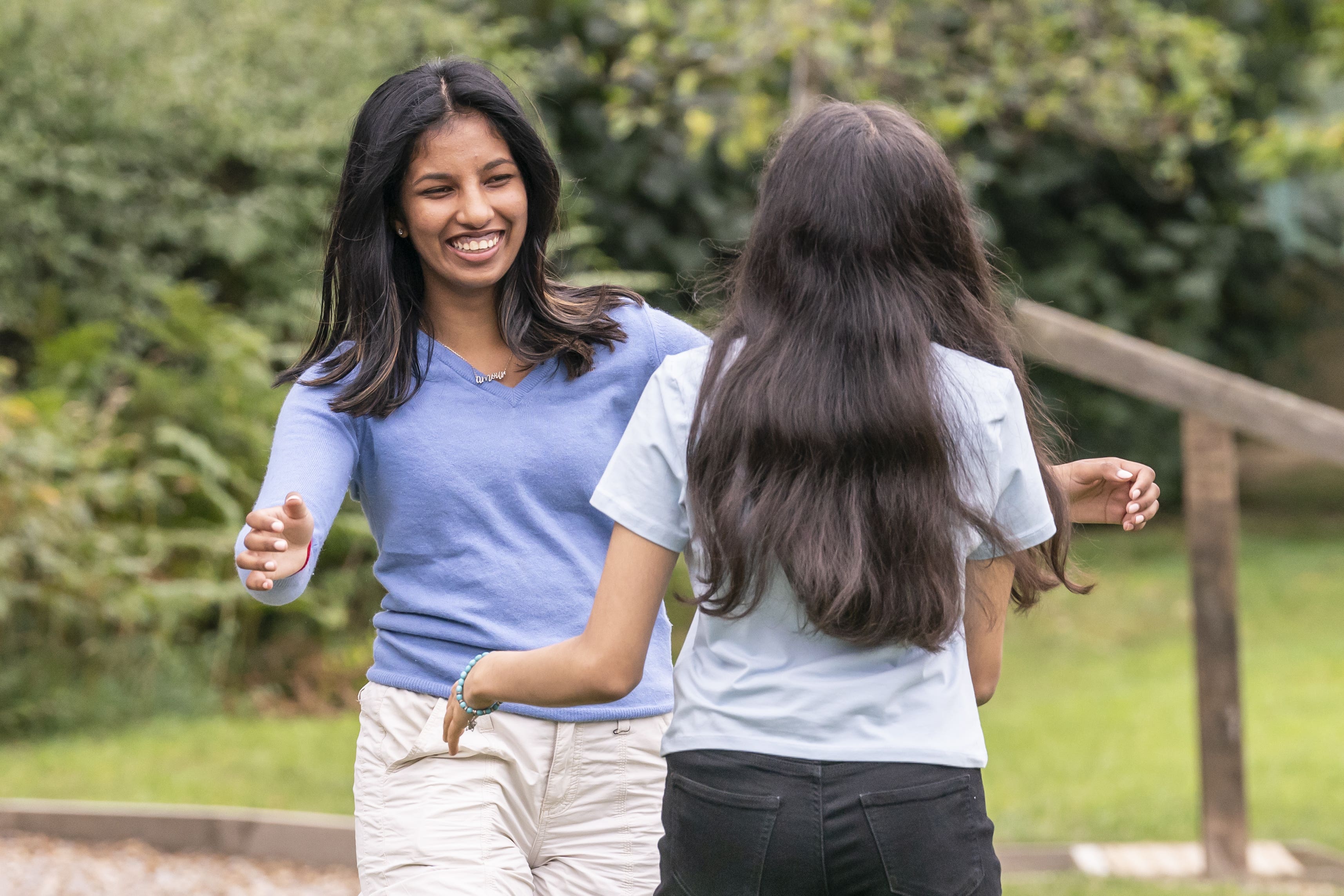 Students celebrate after receiving their GCSE results in 2022 (PA)