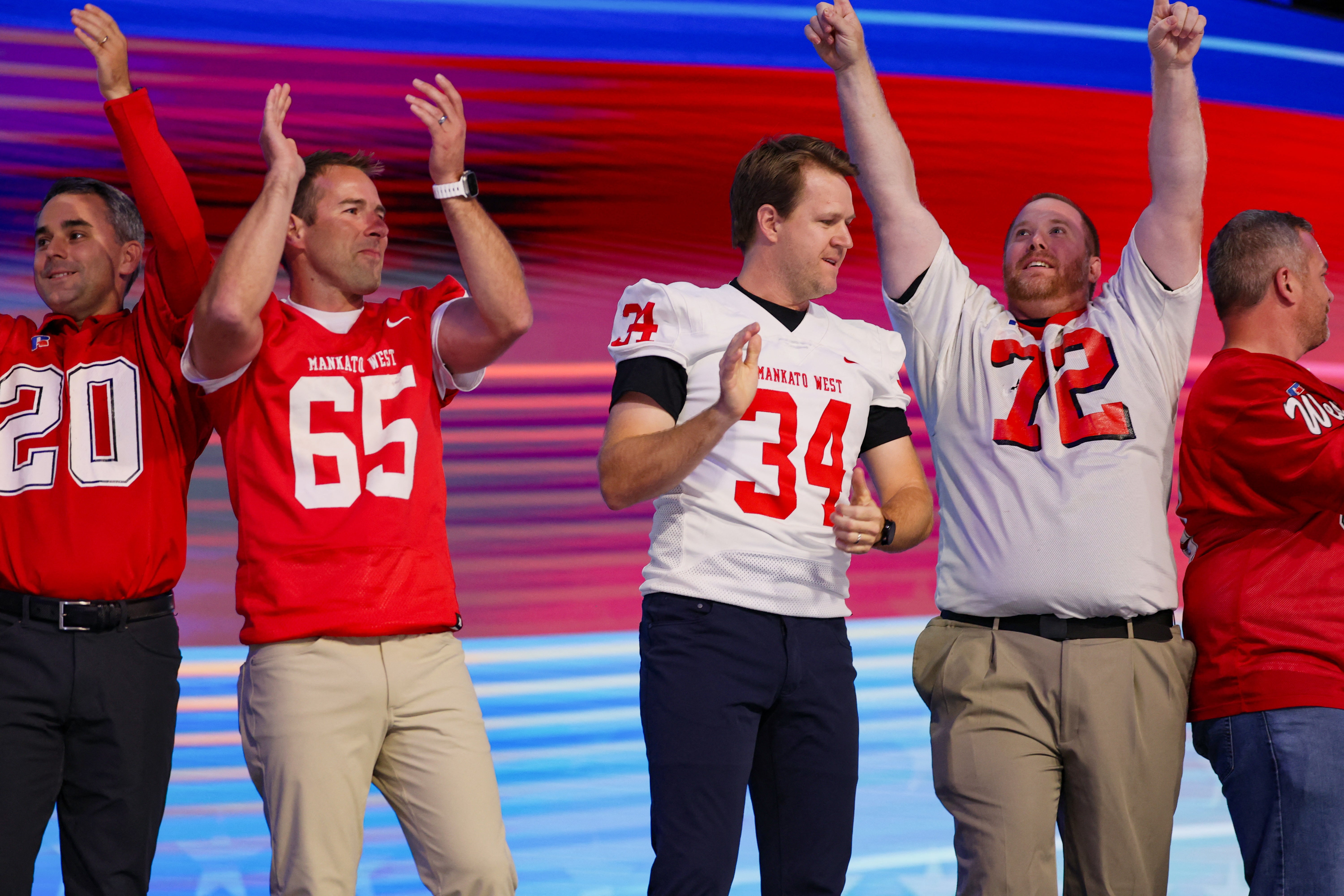 Former football players from Mankato West High School in Minnesota introduced Tim Walz go the stage at the party’s convention in Chicago on August 22