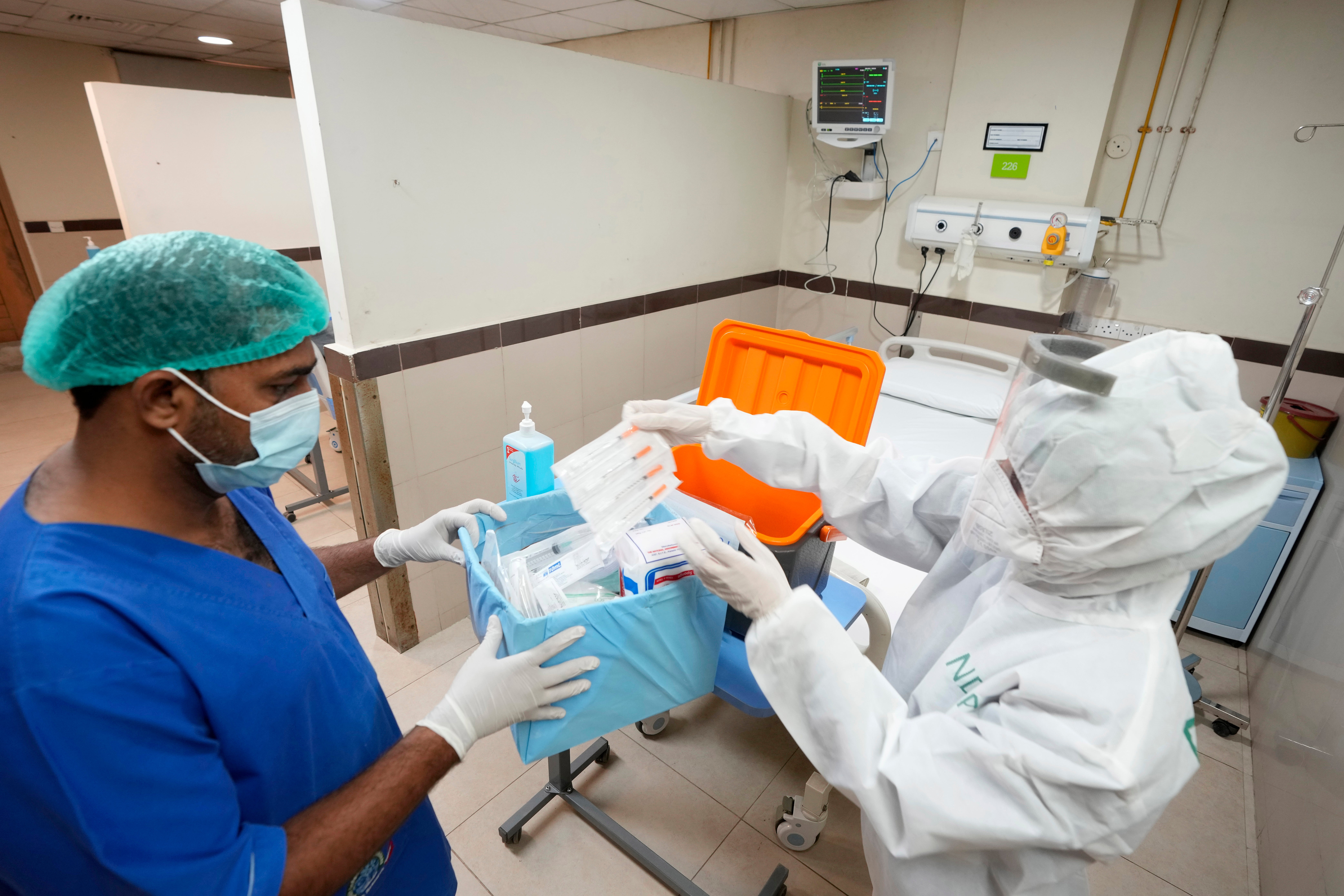 Paramedical staff prepare an isolation ward set up as a preventative measure following Pakistan's health ministry confirmation of a case of mpox (Clade 2) in the Khyber Pakhtunkhwa province, at a hospital in Karachi, Pakistan, Thursday, 22 August 2024