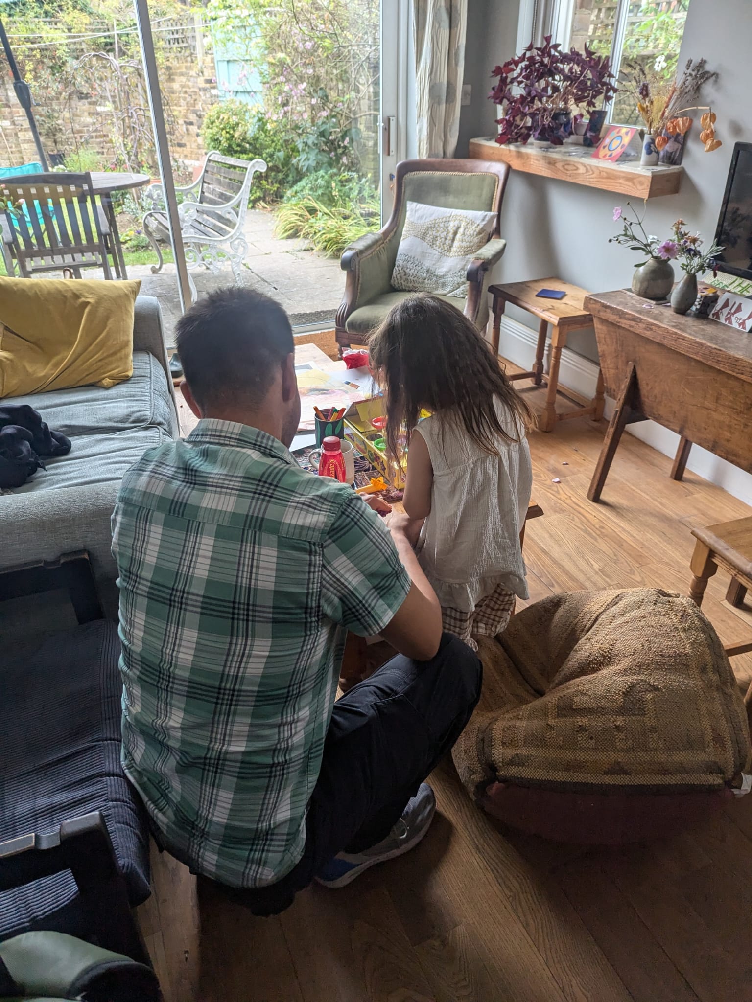 Massud and his young daughter play in their new home