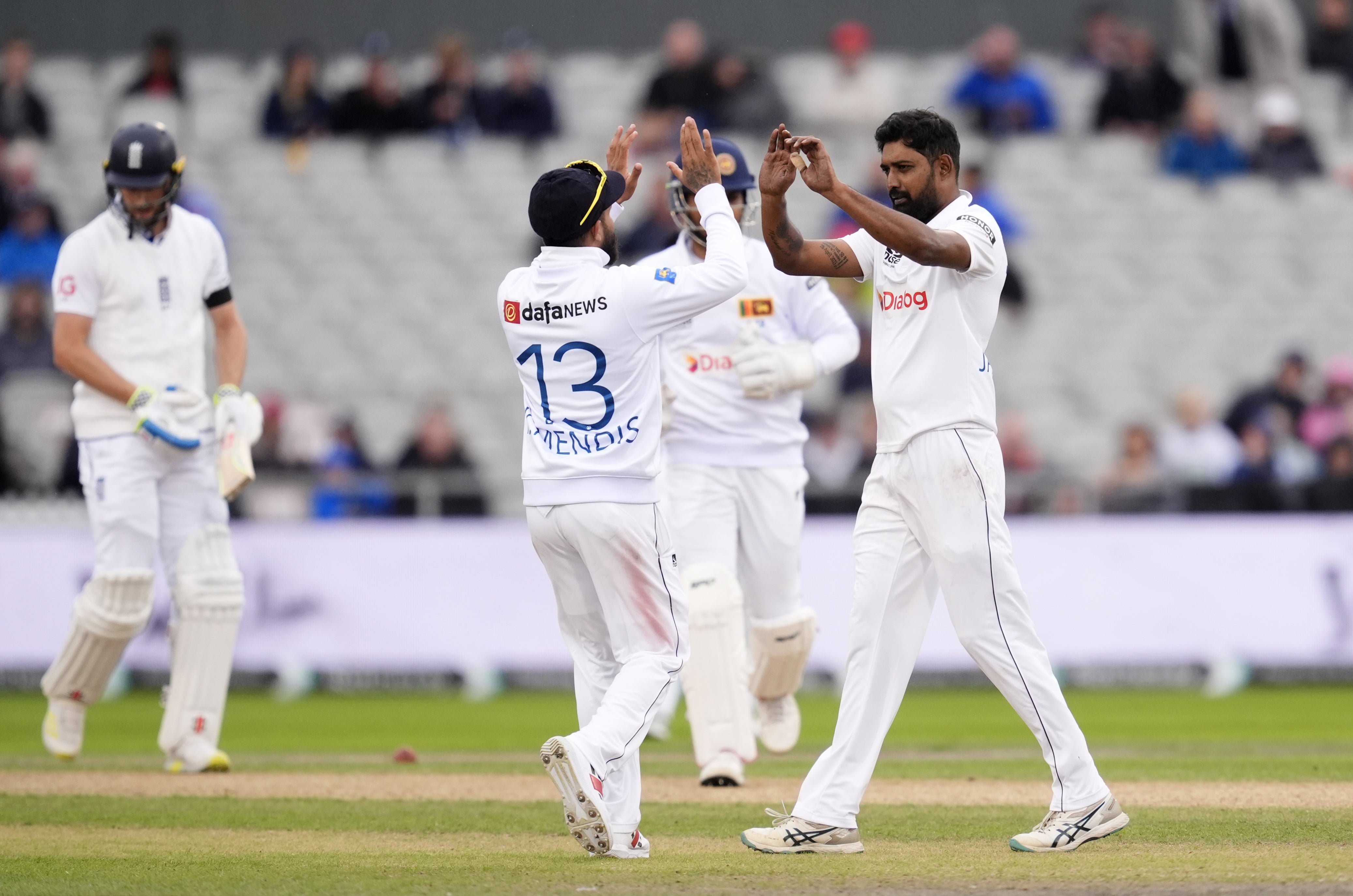 Sri Lanka’s Prabath Jayasuriya (right) celebrates dismissing Chris Woakes (Nick Potts/PA)