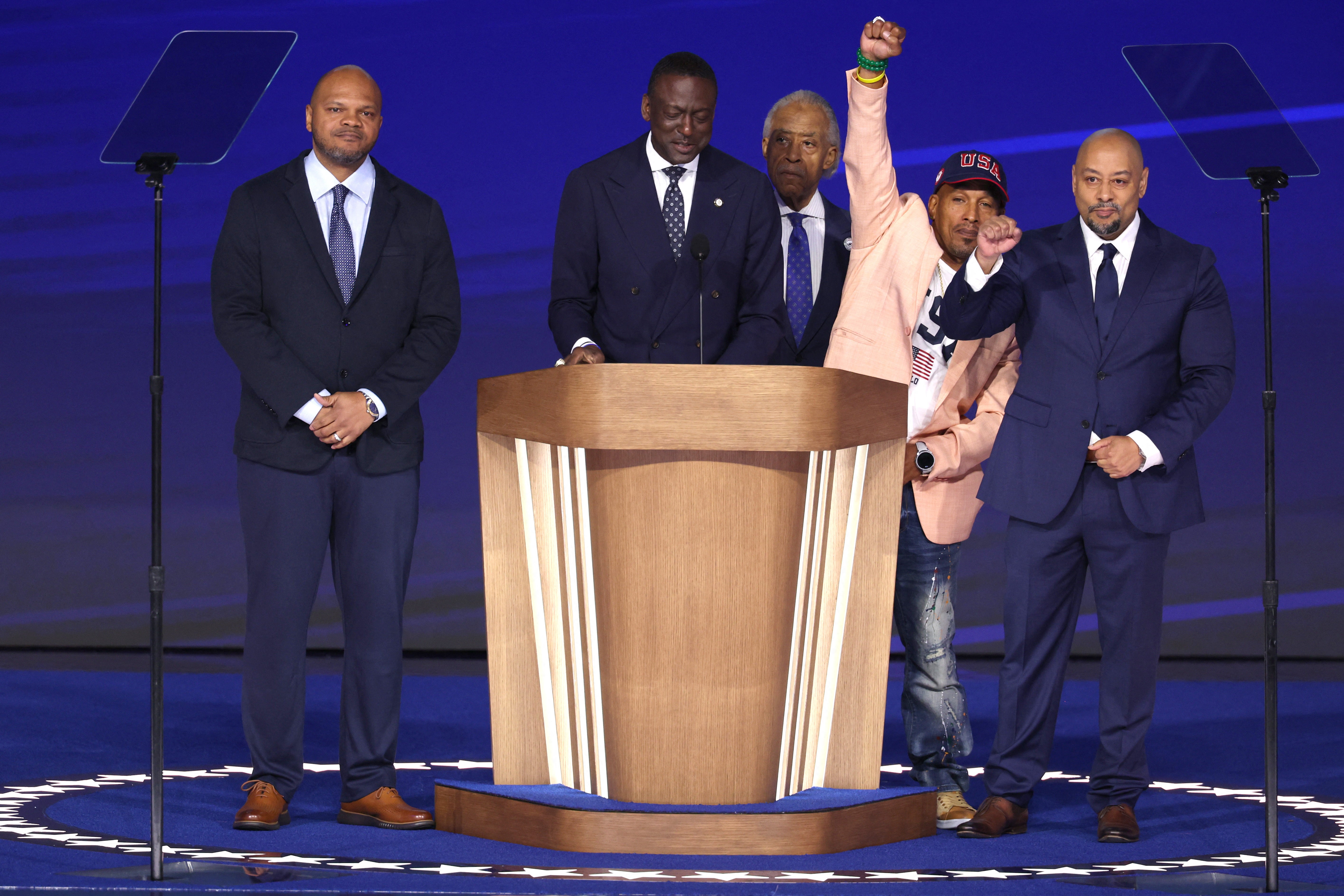 Yusef Salaam, member of the New York City Council and Reverend Al Sharpton stand onstage with Korey Wise, Raymond Santana and Kevin Richardson, members of the Central Park Five