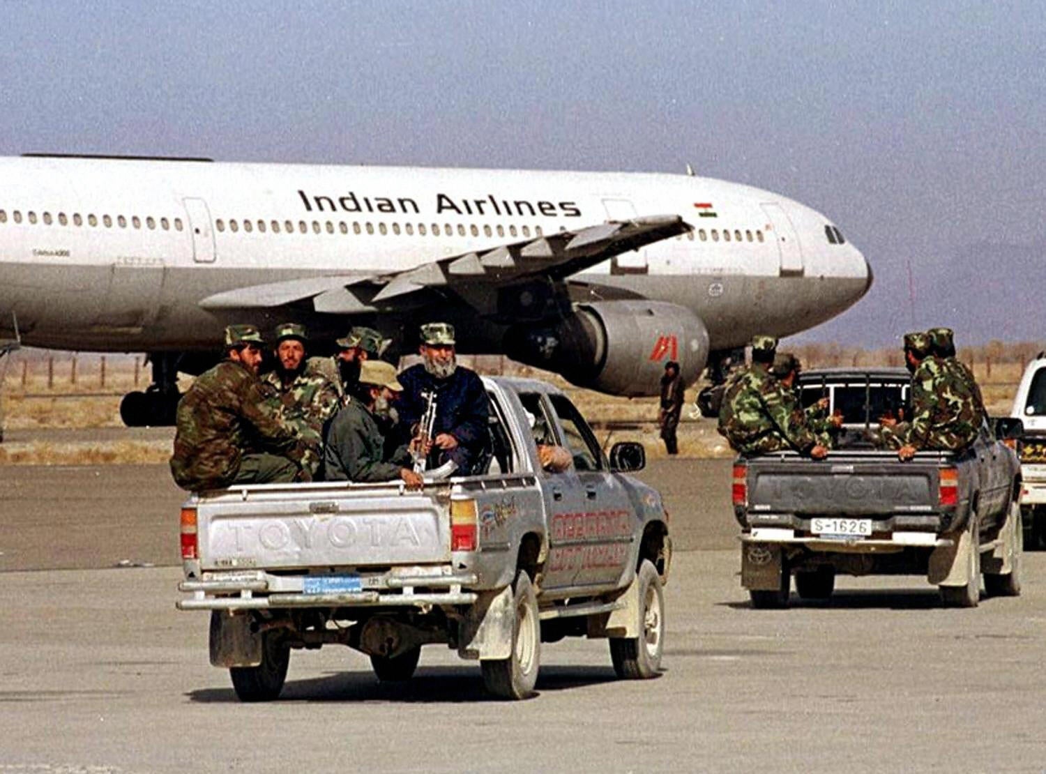 Afghan Taliban militia head towards a hijacked Indian Airlines Airbus AC-814 at Kandahar Airport on 27 December, 1999