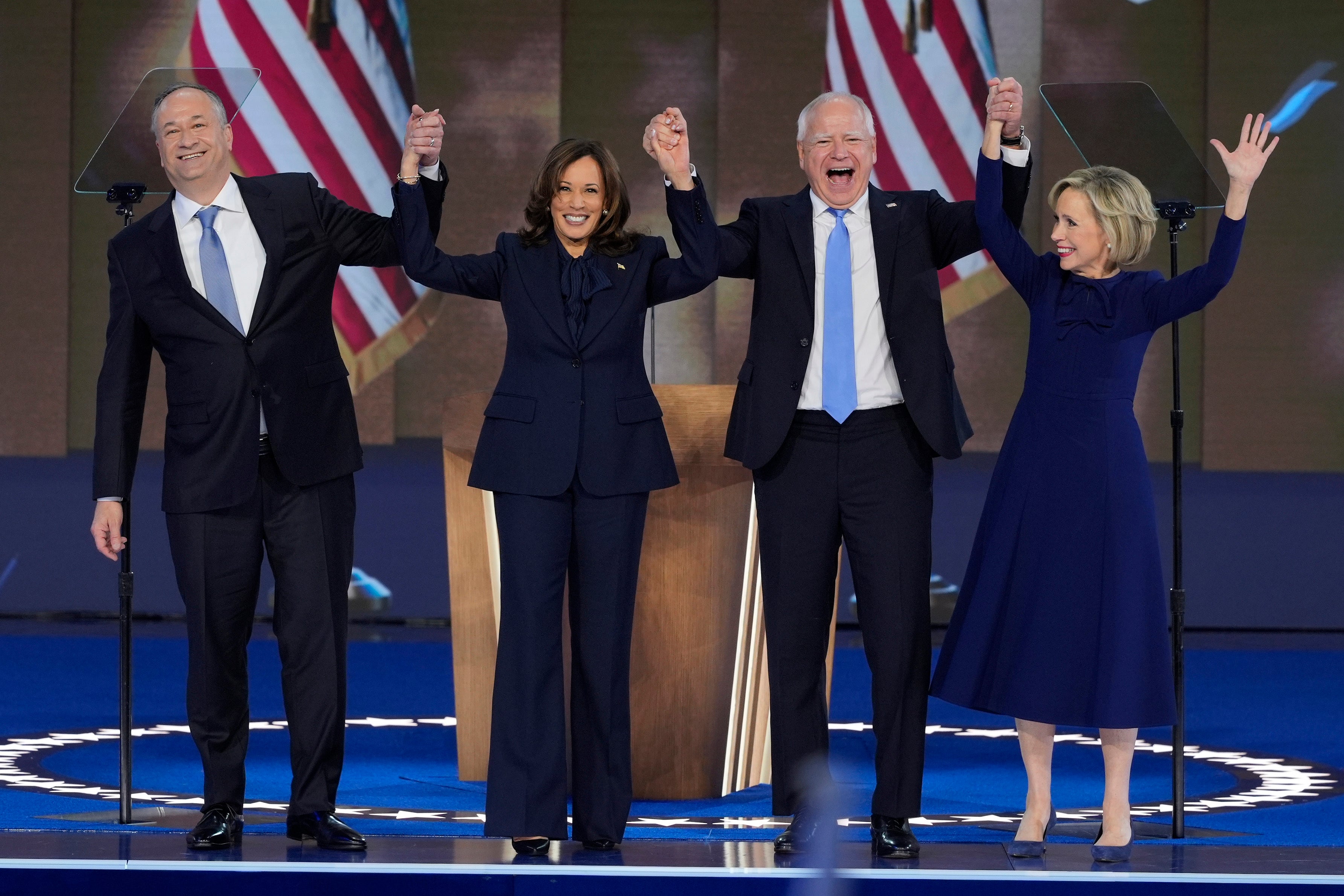 Emhoff, Harris, Tim Walz and his wife Gwen Walz on stage together