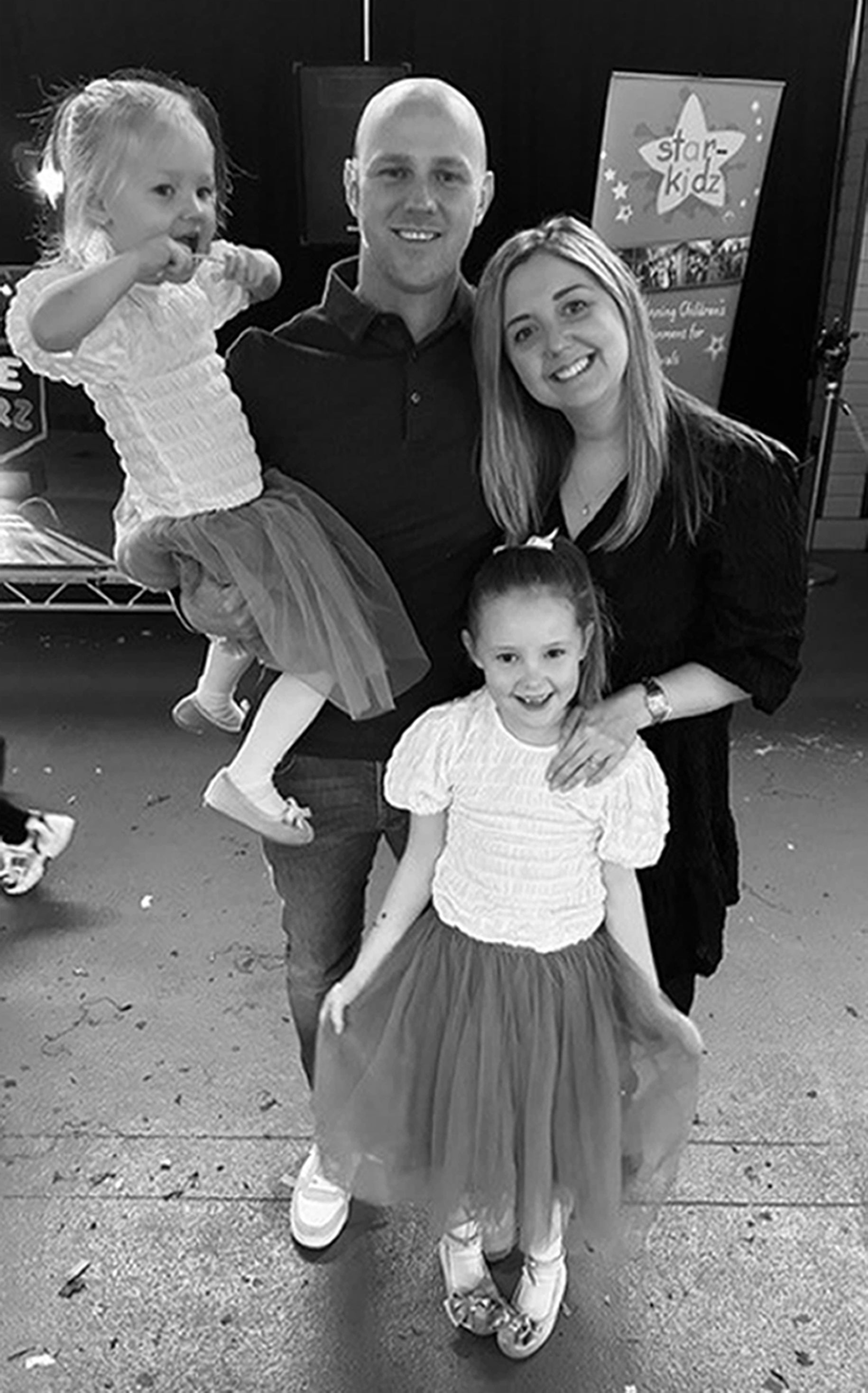 Elsie Dot Stancombe with her mother Jenni, father David and younger sister Rosie, aged three