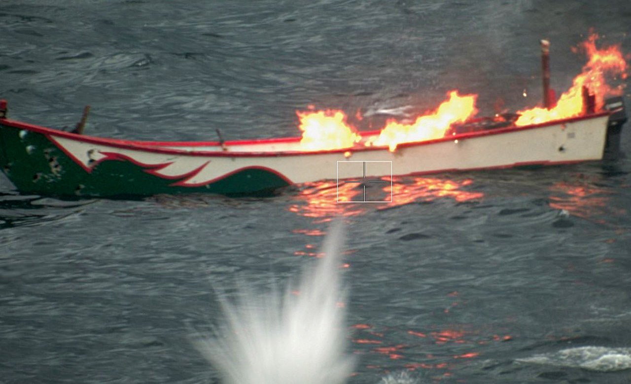 A handout photo made available by EUNAVFOR ASPIDES shows an unmanned surface vehicle being neutralized by a unit of the European operation Aspides