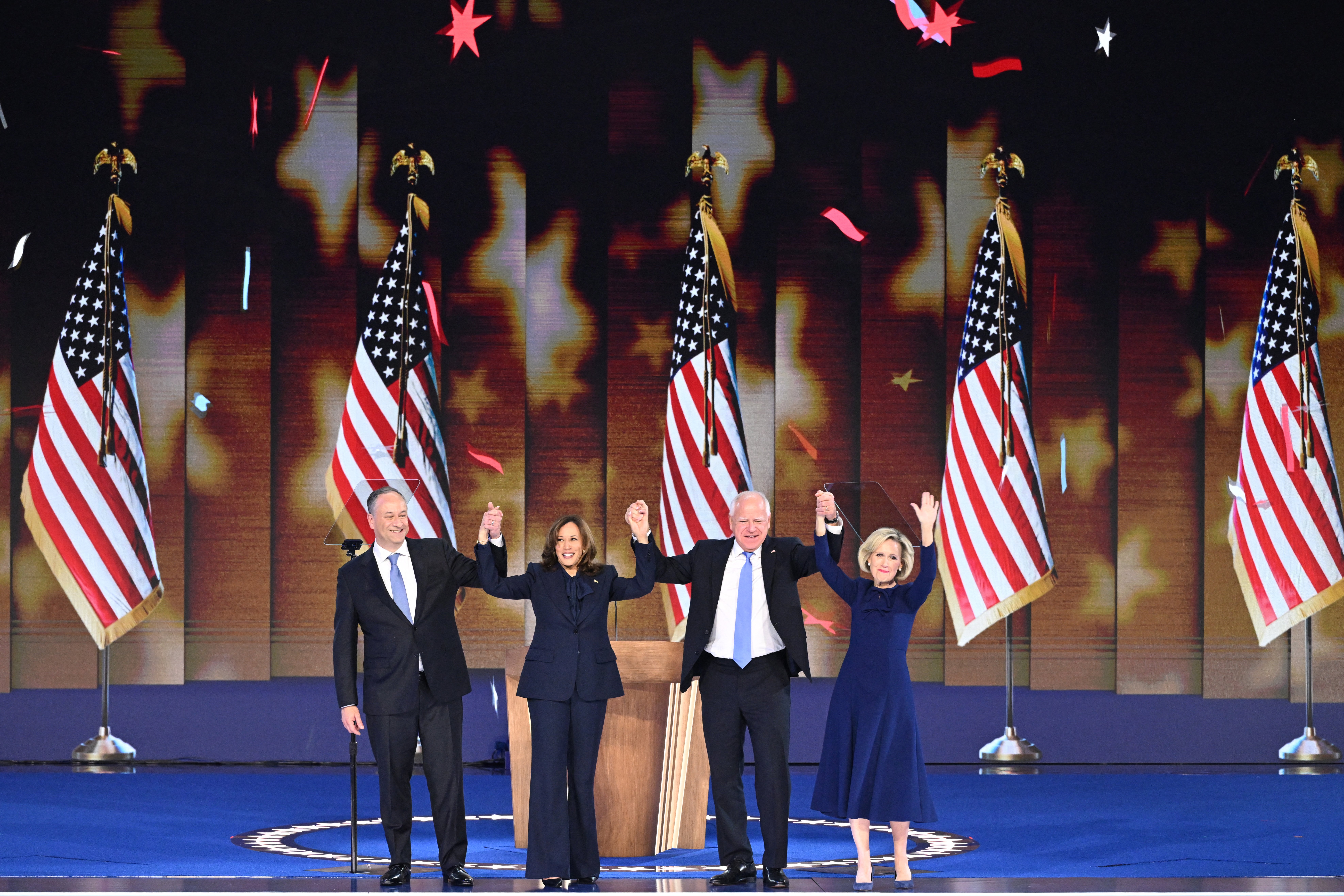 Democratic presidential candidate Kamala Harris onstage with Second Gentleman Douglas Emhoff, Minnesota Governor and Democratic vice presidential candidate Tim Walz and his wife Gwen Walz