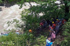 At least 14 killed after bus carrying Indian pilgrims plunges into river in Nepal