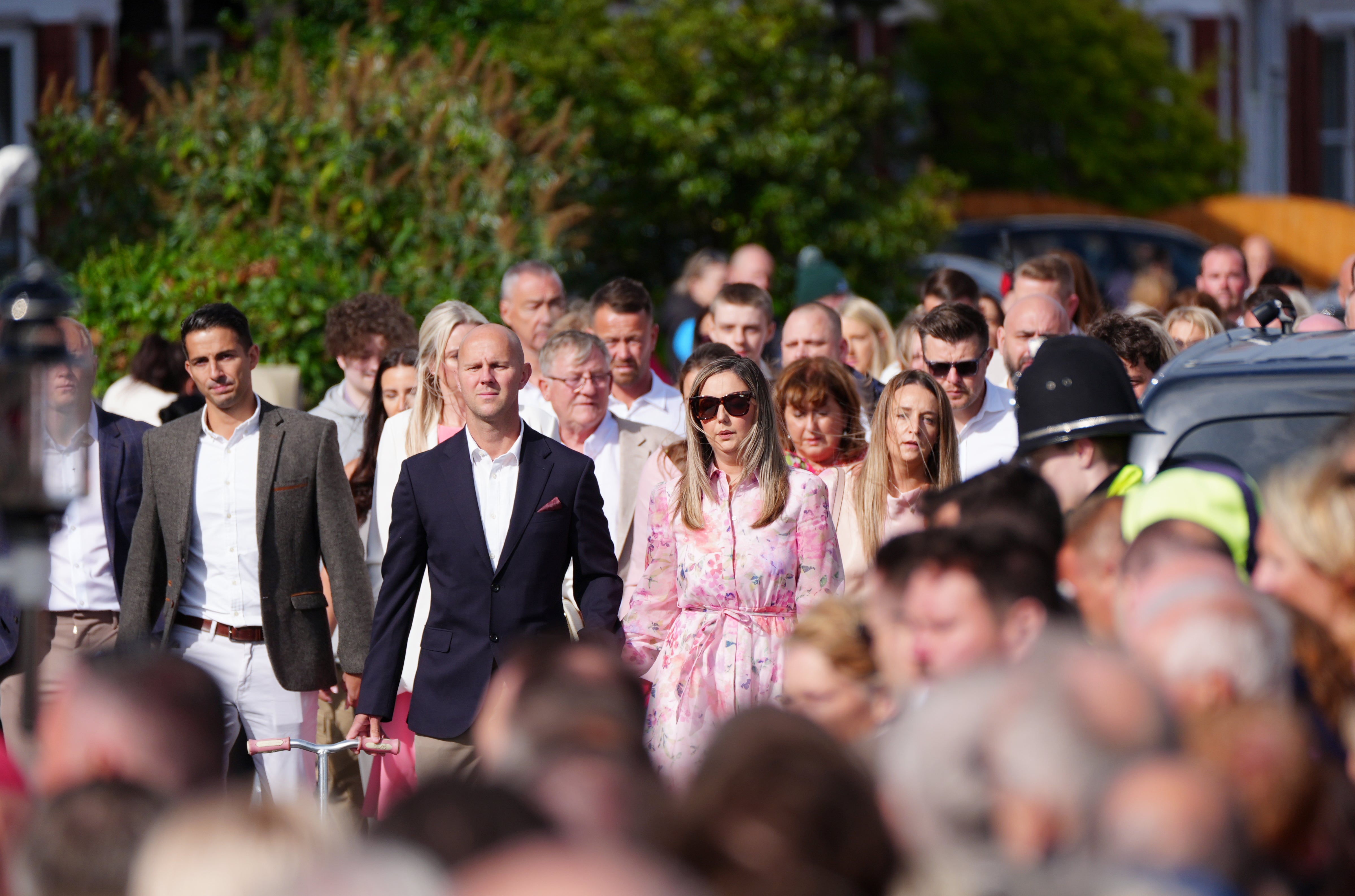 Elsie’s parents led the procession behind their daughter’s coffin