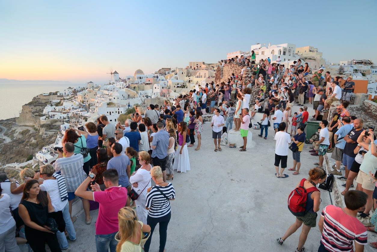 Santorini’s famed sunsets are known for drawing a crowd