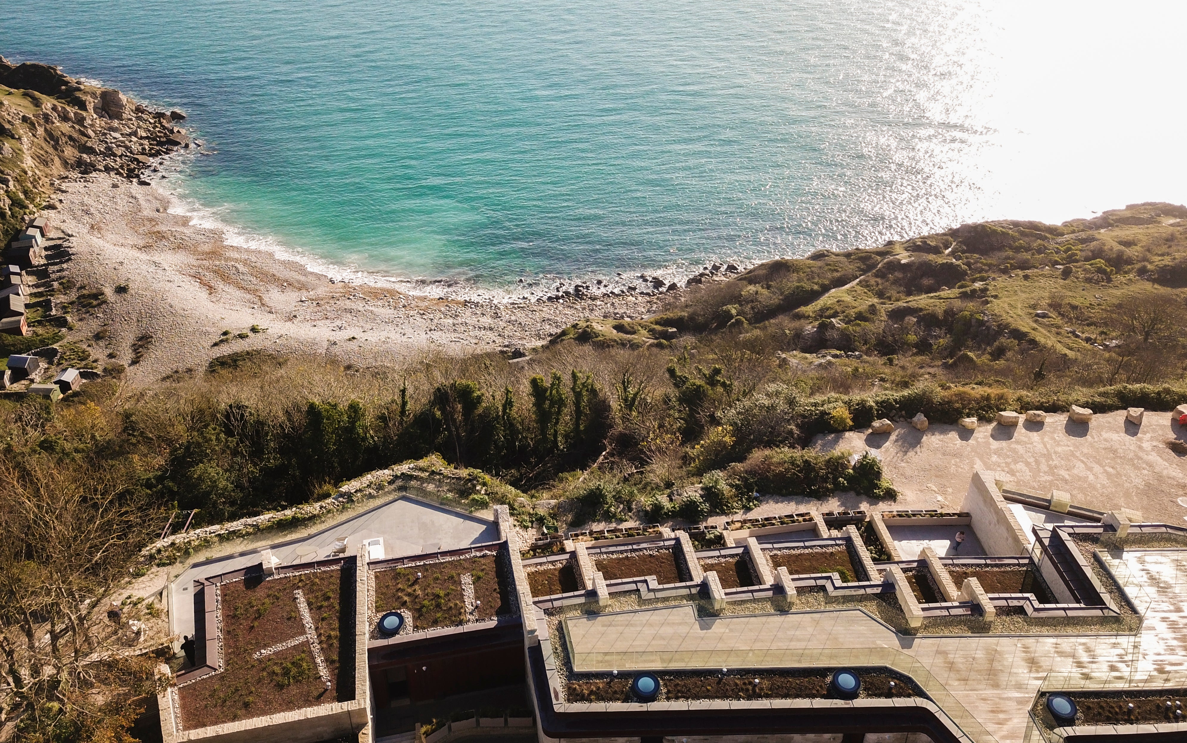 The idyllic lodges nestled into the Portland stone cliffs