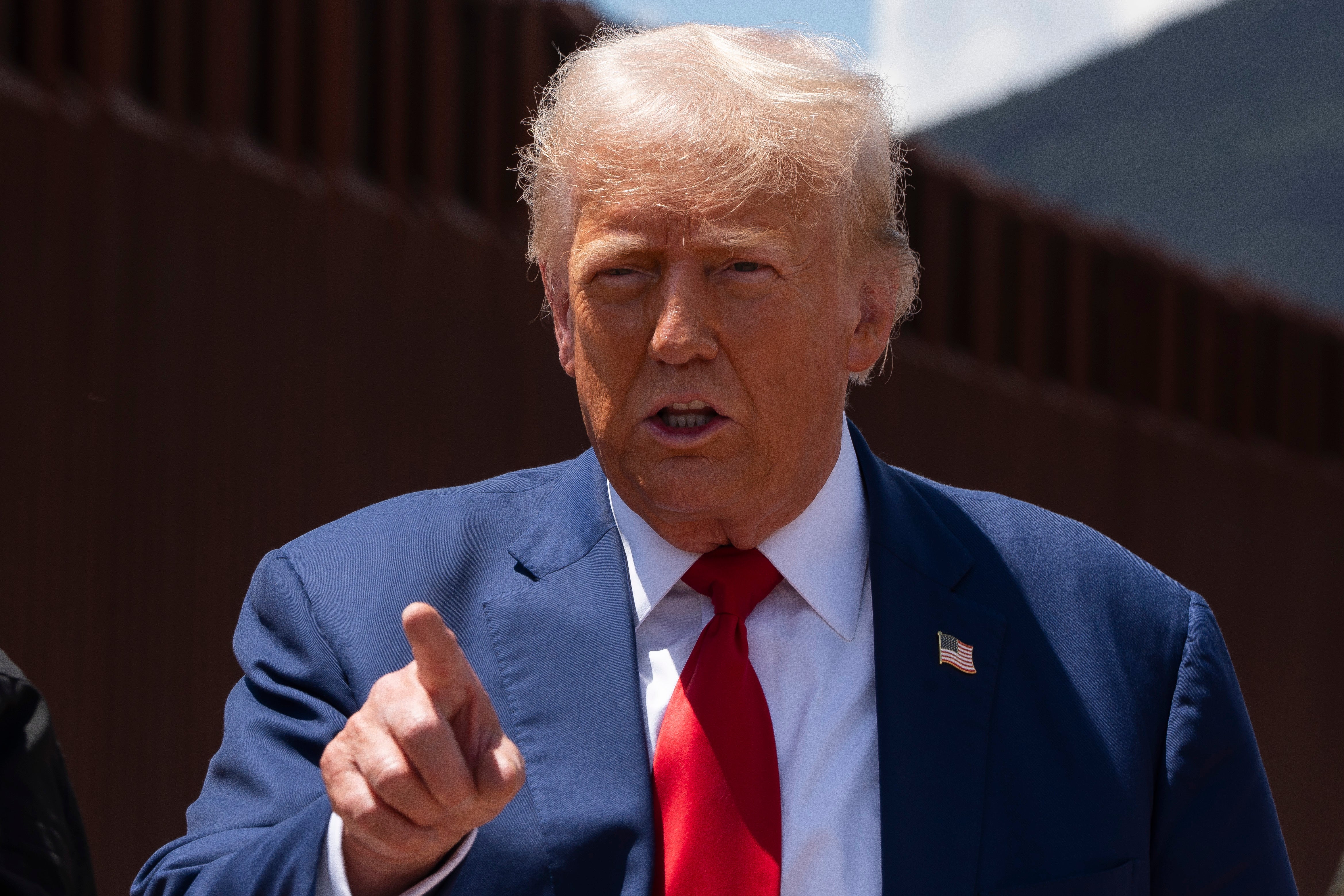 Former president Donald Trump speaks at the U.S.-Mexico border on Thursday. Trump has called climate change a ‘hoax’ and deemed related policies the ‘Green New Scam.’