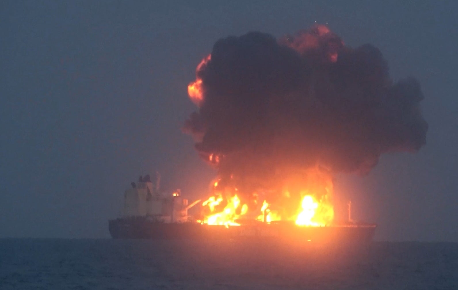 A handout screen grab taken from a video released by the Houthis media center on 23 August 2024 shows flames and smoke rising from an explosion at the Greek-flagged oil tanker Sounion after an attack in the Red Sea, Yemen