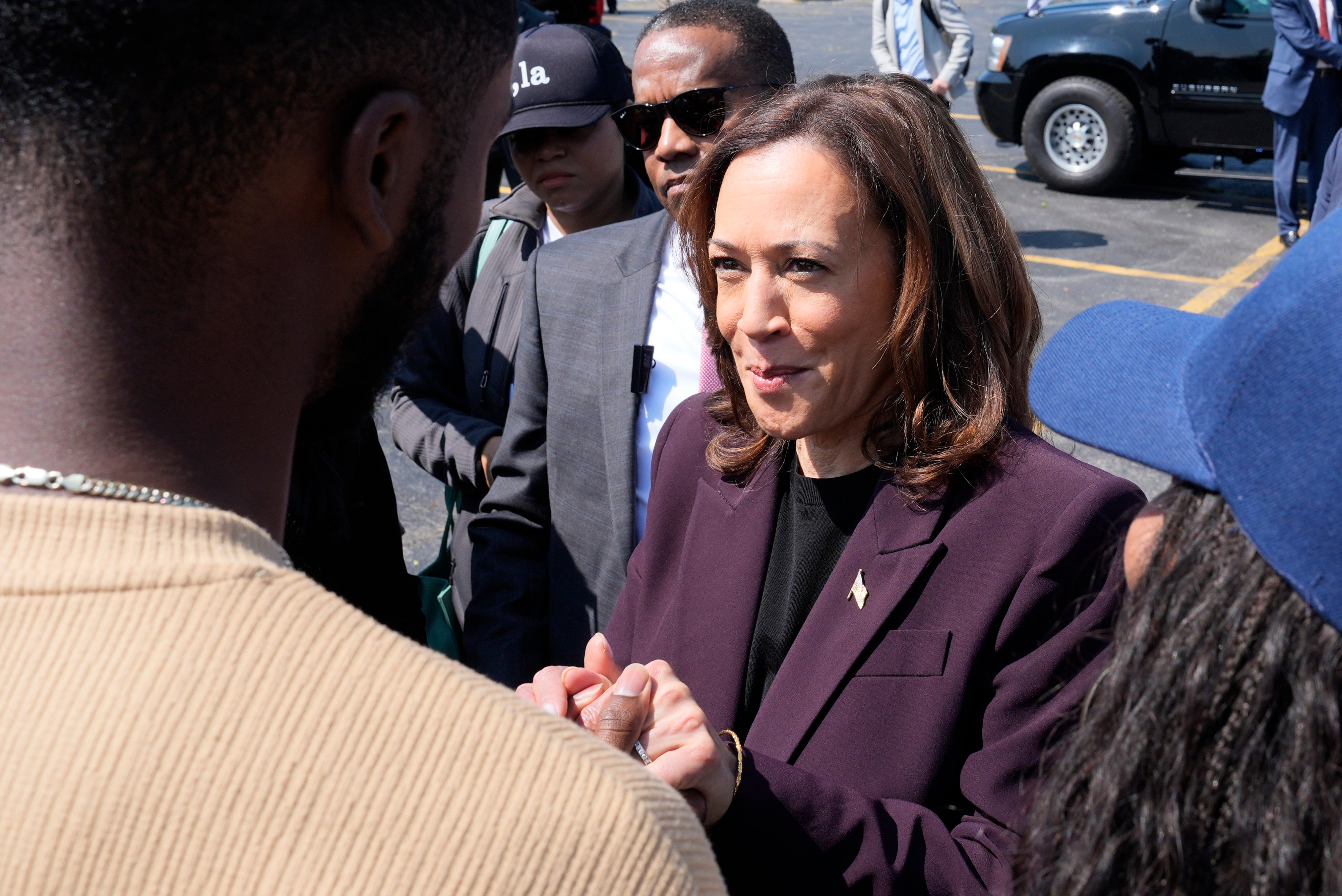 Kamala Harris greets supporters before boarding Marine Two at Soldier Field in Chicago. A Republican group has argued that she’s ineligible to be president