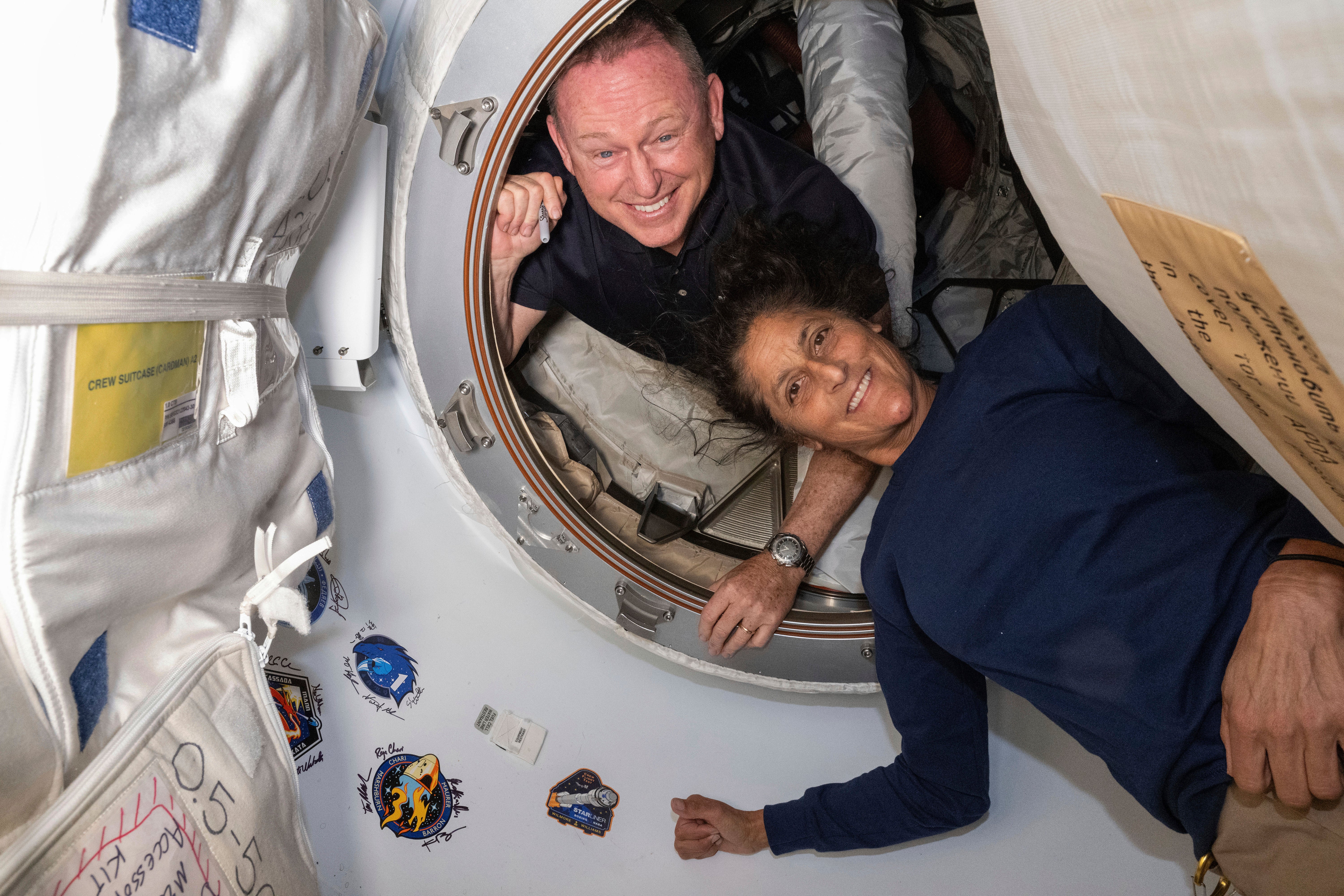 Wilmore and Williams in the vestibule which links the module and the Starliner craft