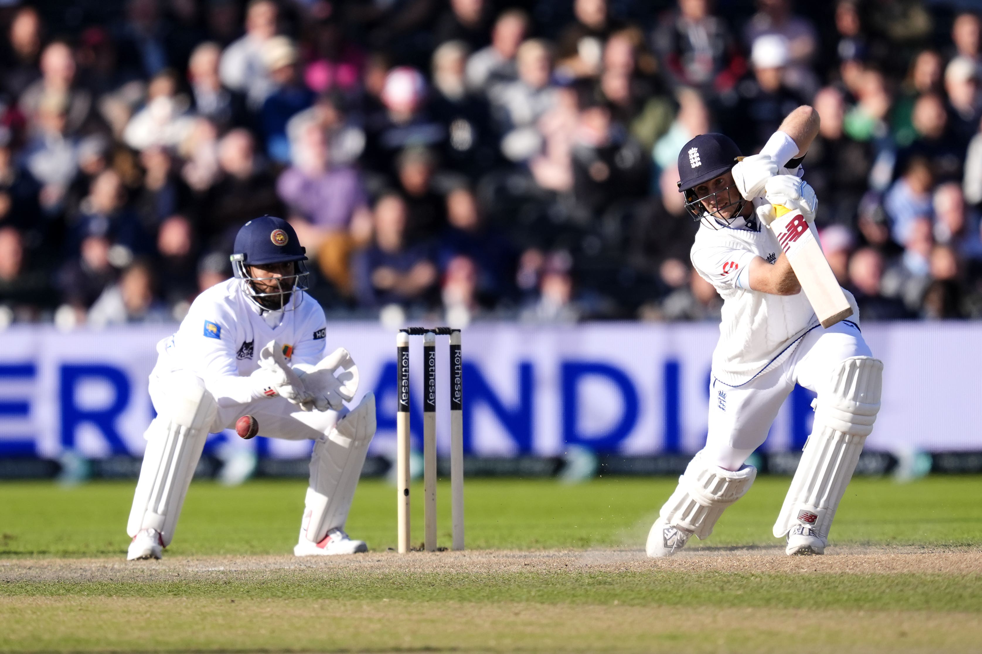 Joe Root made an unbeaten half-century to help England to victory.