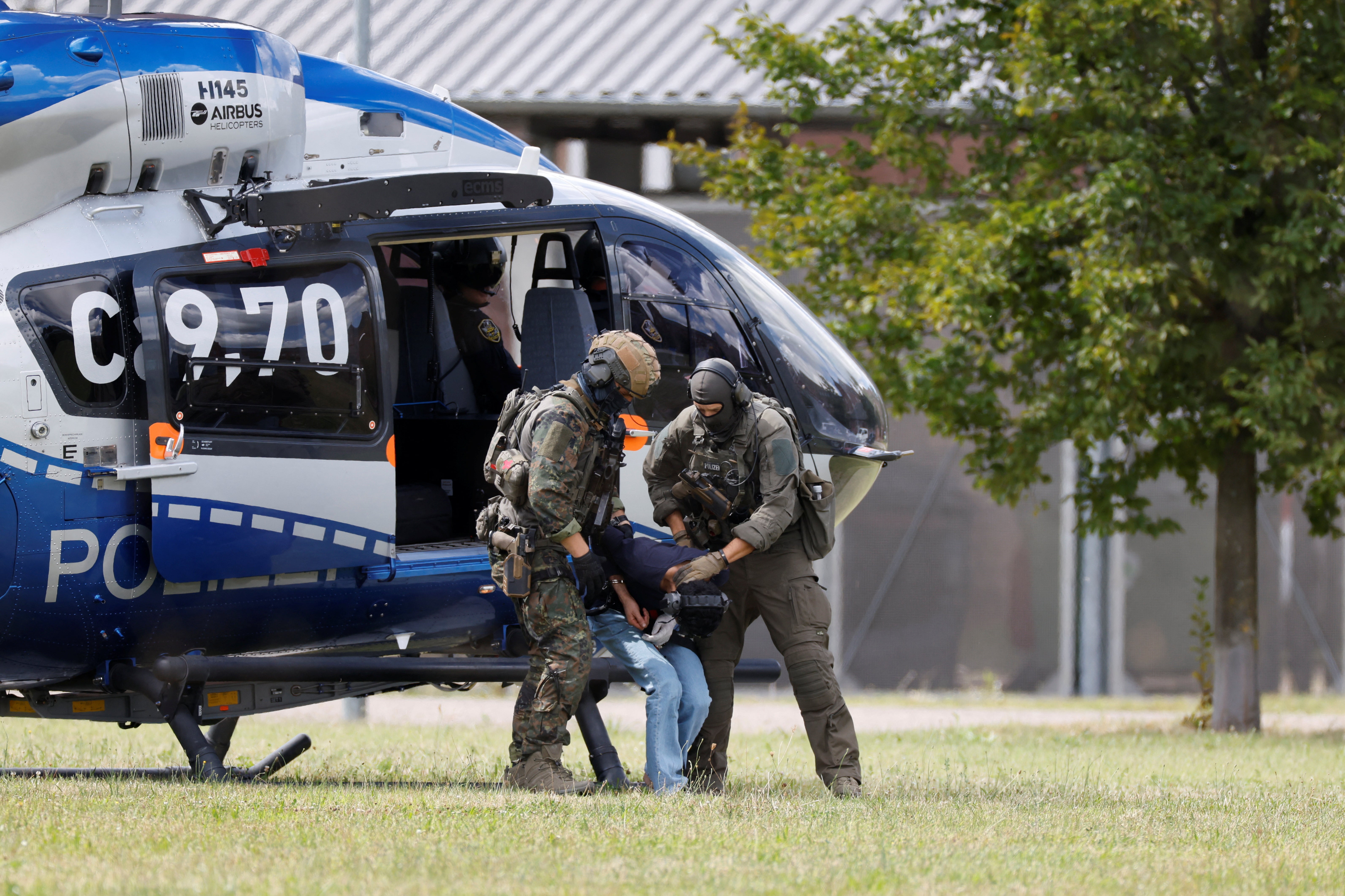 A suspect in the mass stabbing at a festival in Solingen, west Germany, was escorted to the Federal Public Prosecutor in Karlsruhe, Germany