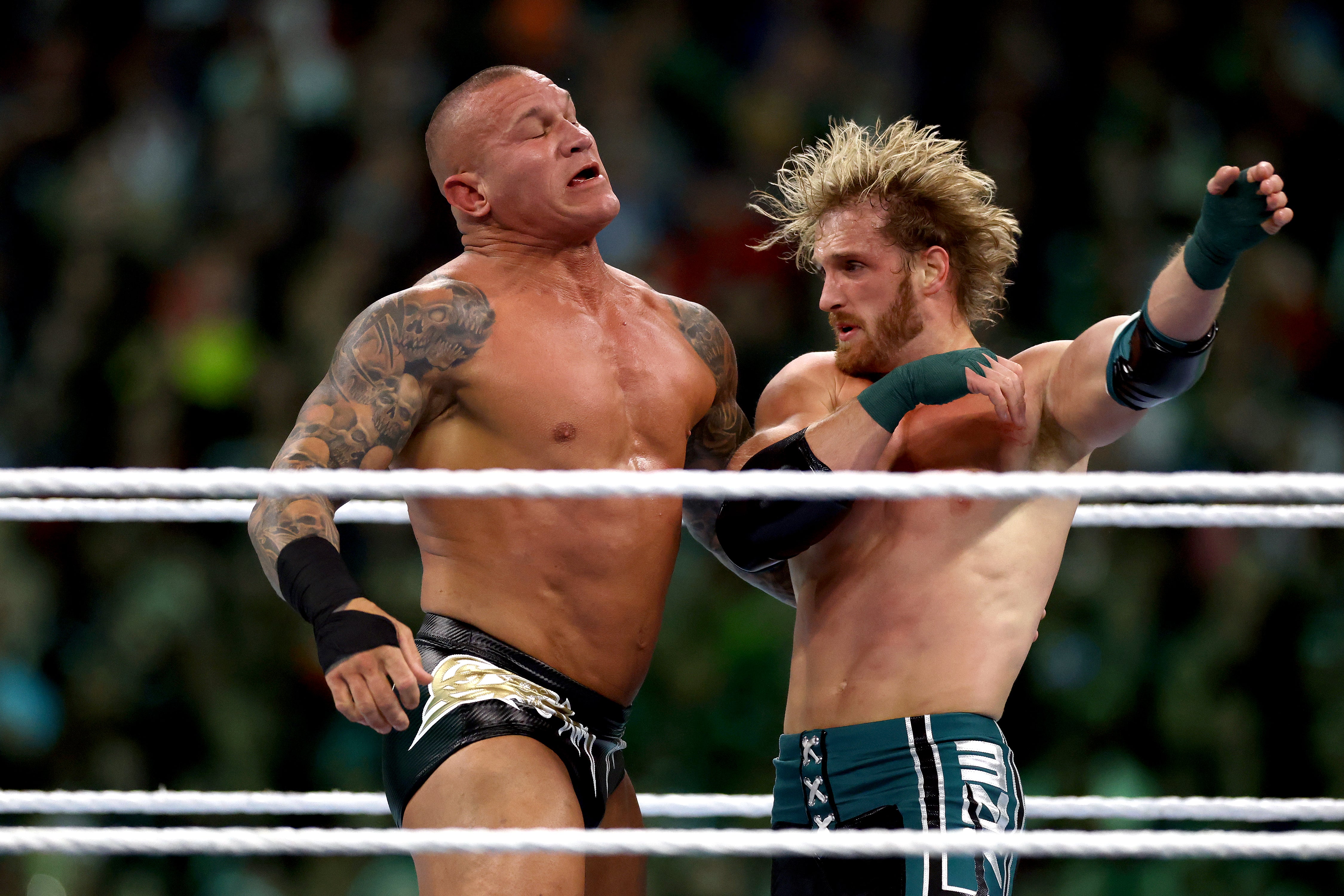 Logan Paul and Randy Orton fighting at WrestleMania 40