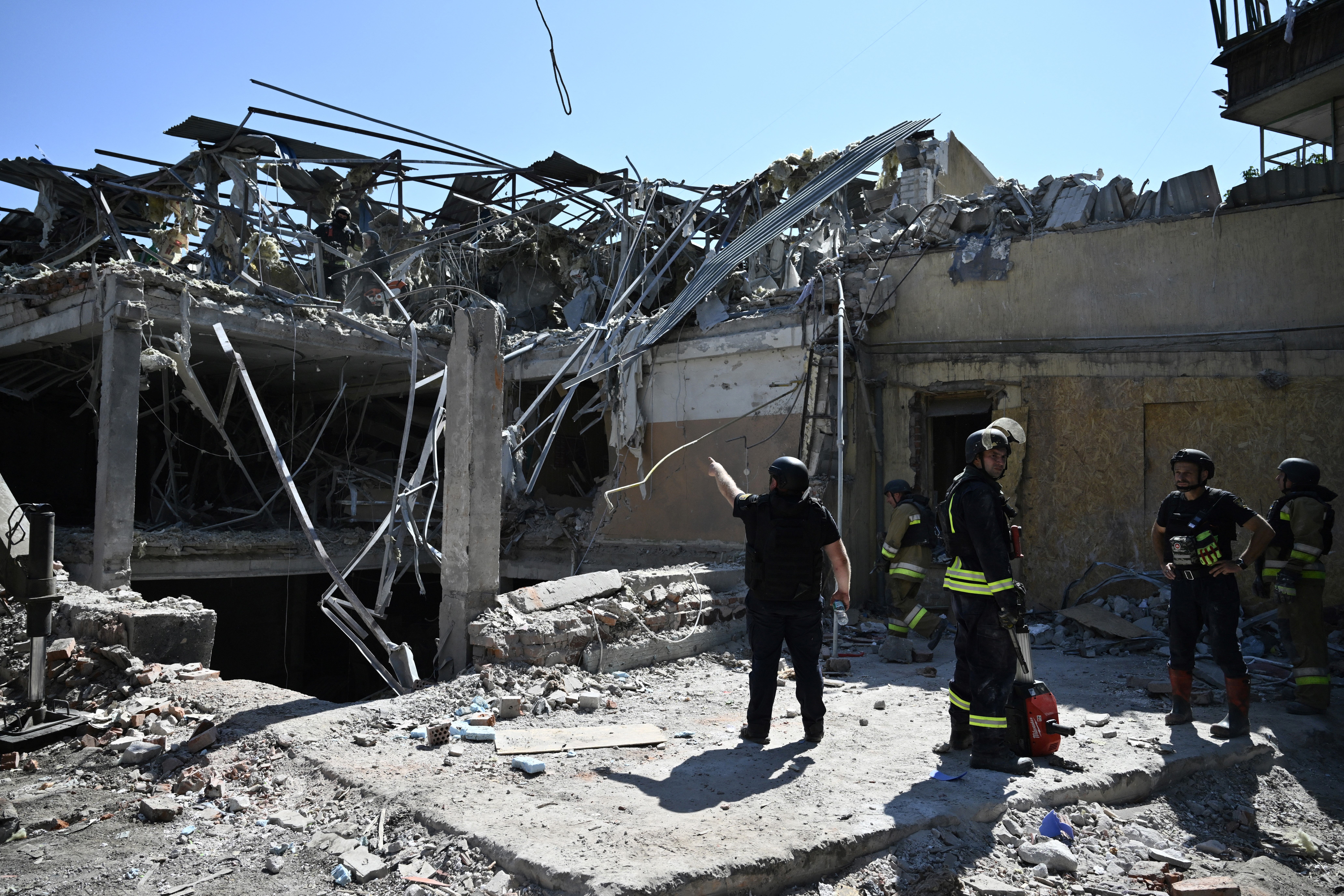 Ukrainian emergency services carry out a search and rescue operation among the rubble of a destroyed hotel after a strike in the town of Kramatorsk, Donetsk region