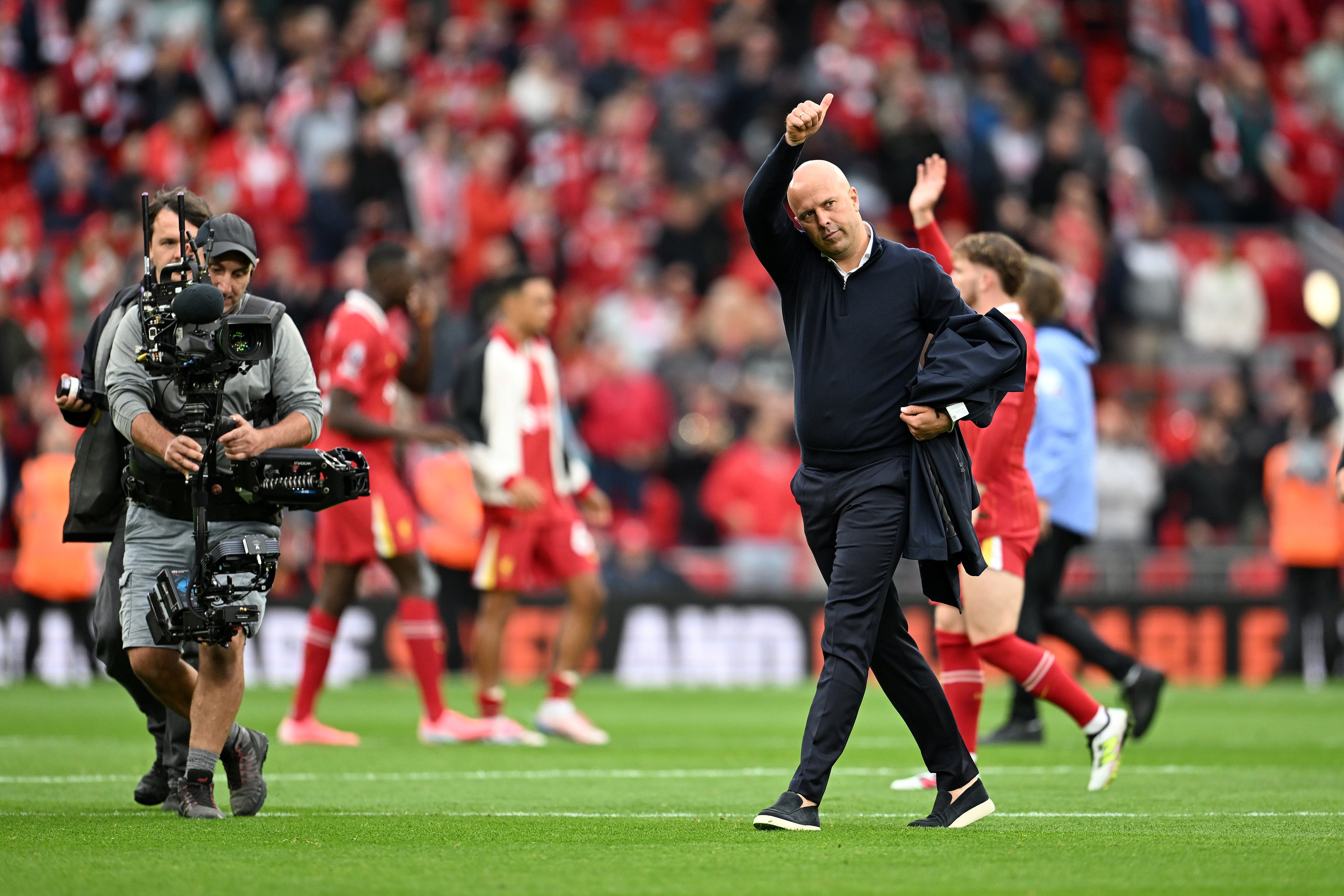 Arne Slot salutes the Anfield crowd after Liverpool’s 2-0 win over Brentford