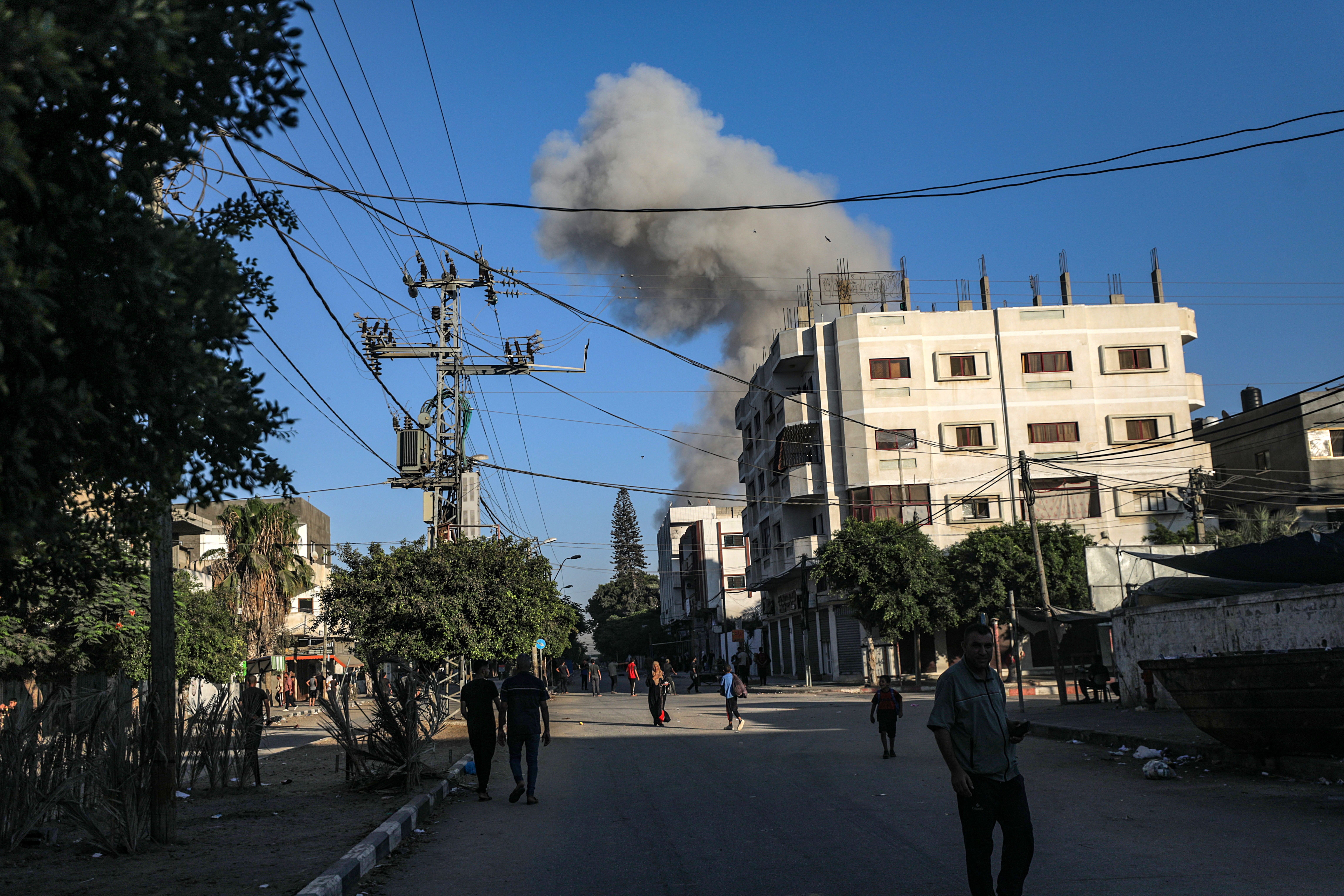 Smoke was seen during an Israeli military operation in Deir al-Balah on Sunday