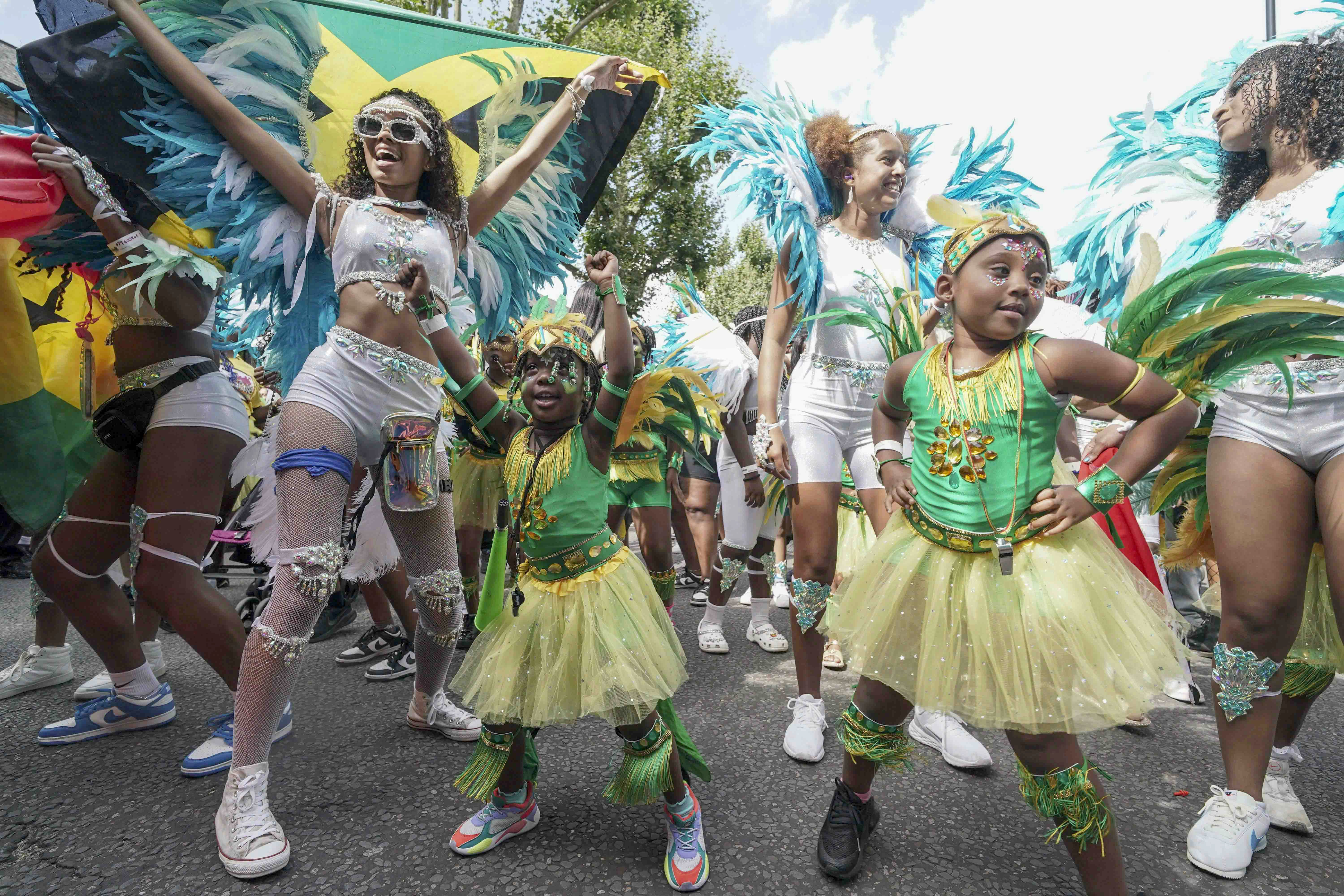 Children take part in the parade on Sunday’s family day