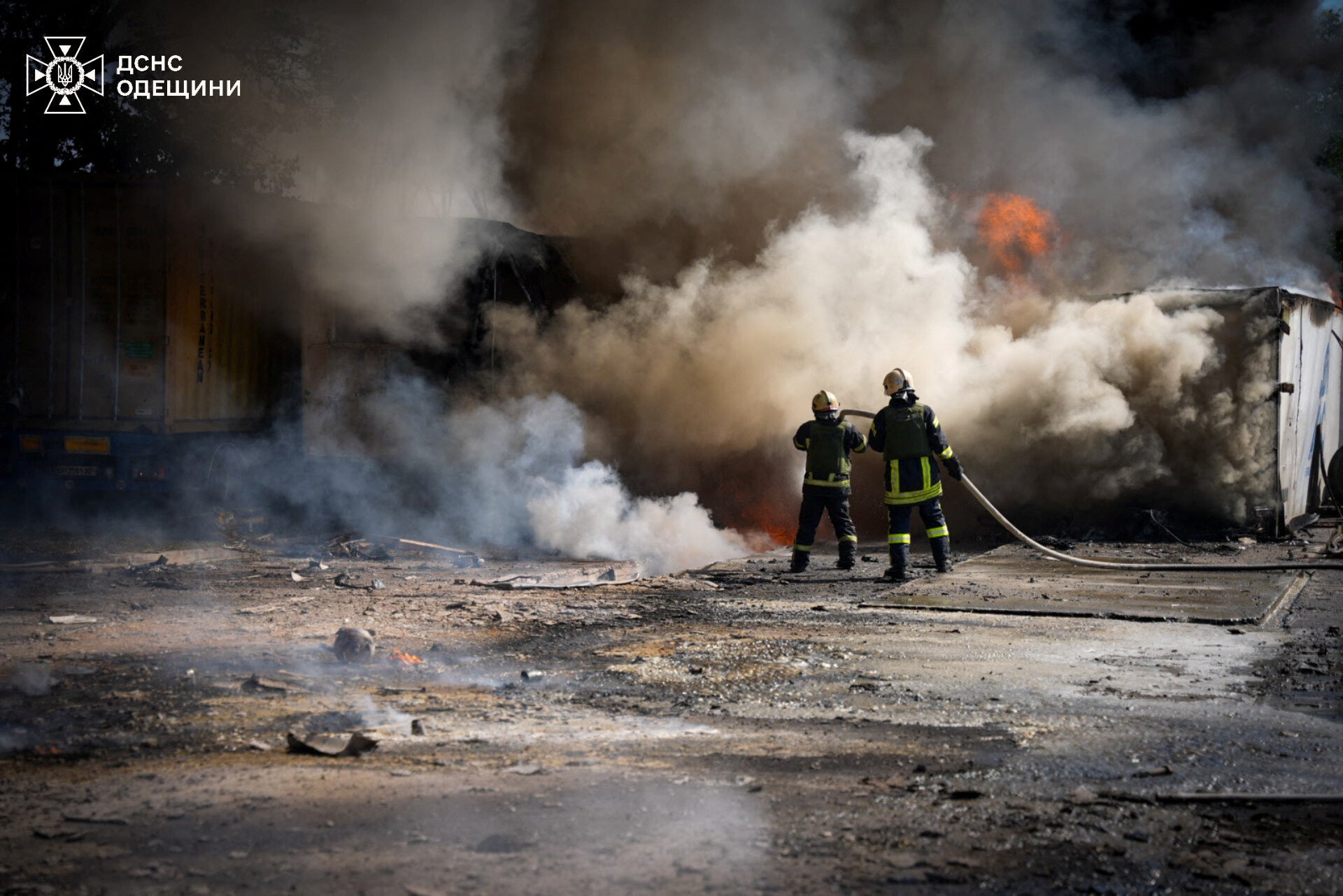 Firefighters work at the site of a Russian missile strike in the Odesa region of Ukraine on Monday