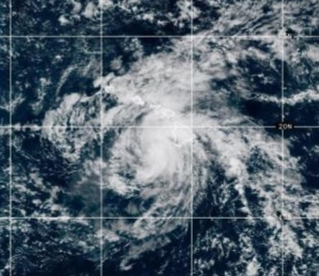 <p>Tropical Storm Hone swirls over the central Pacific late Sunday night.  The storm brought dangerous winds and flash flooding to the Hawaiian Islands, knocking out power for thousands of customers.</p>