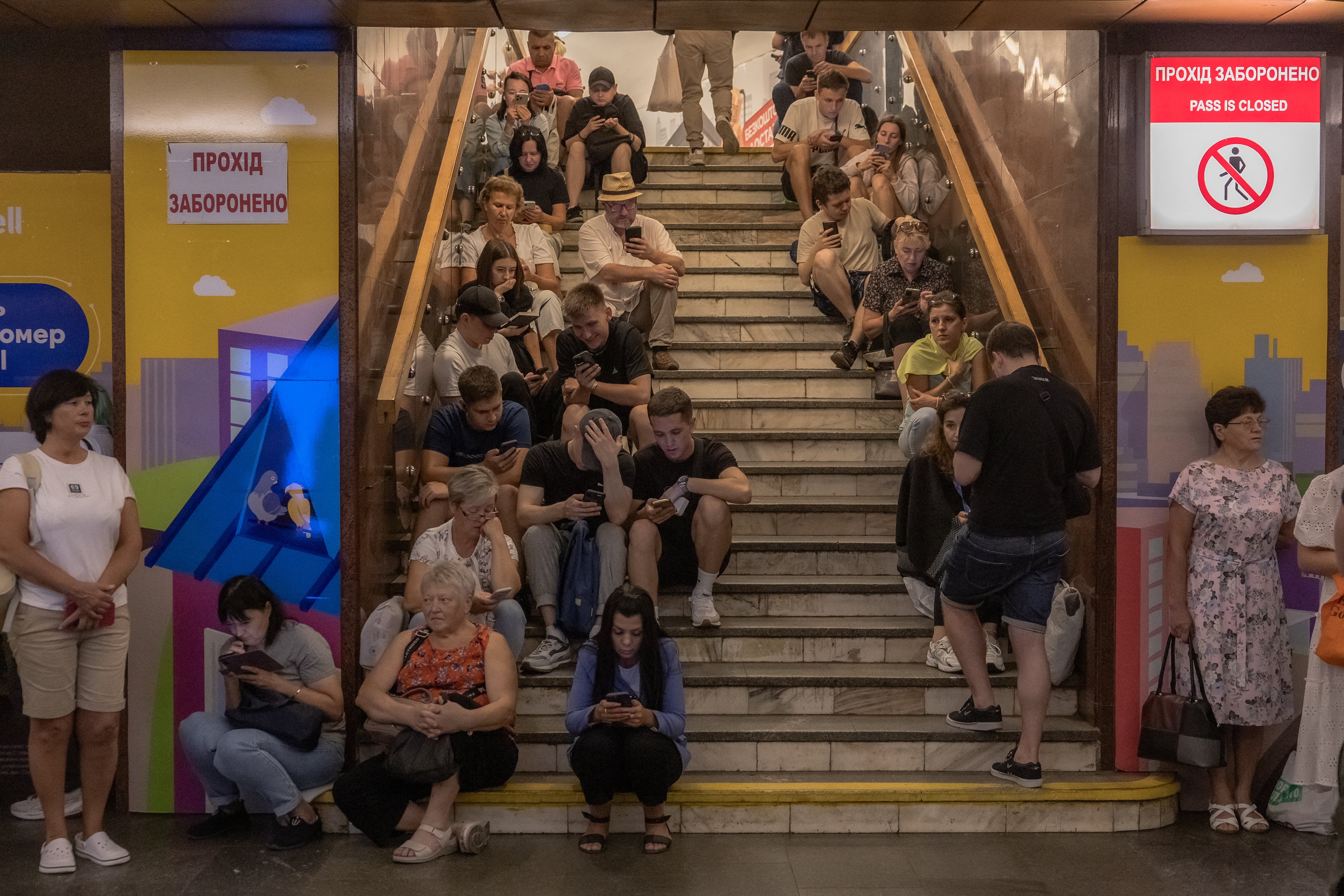 Civilians shelter at a Kyiv metro station on Monday during the air bombardment