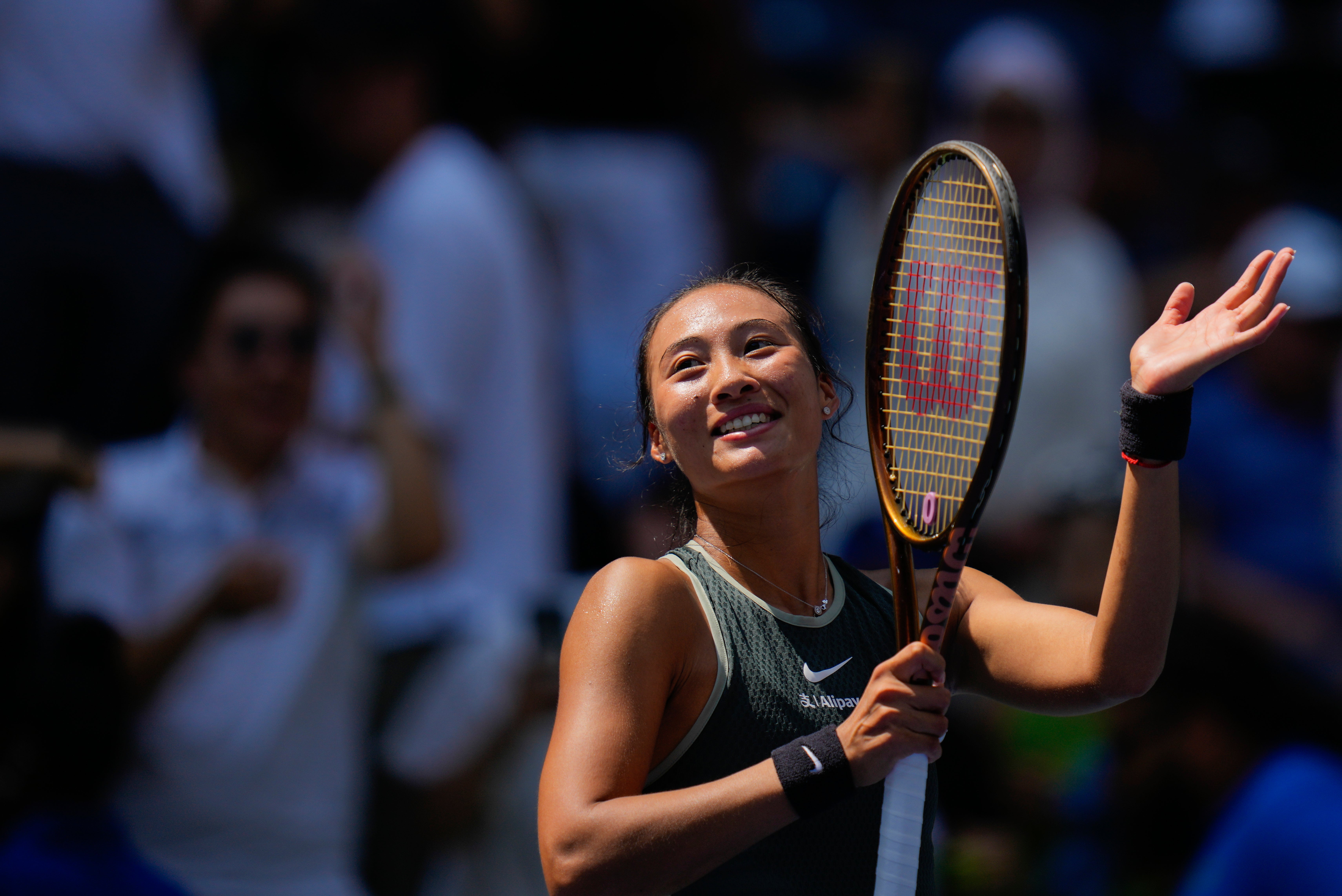 Olympic champion Qinwen Zheng survived a scare (Kirsty Wigglesworth/AP)