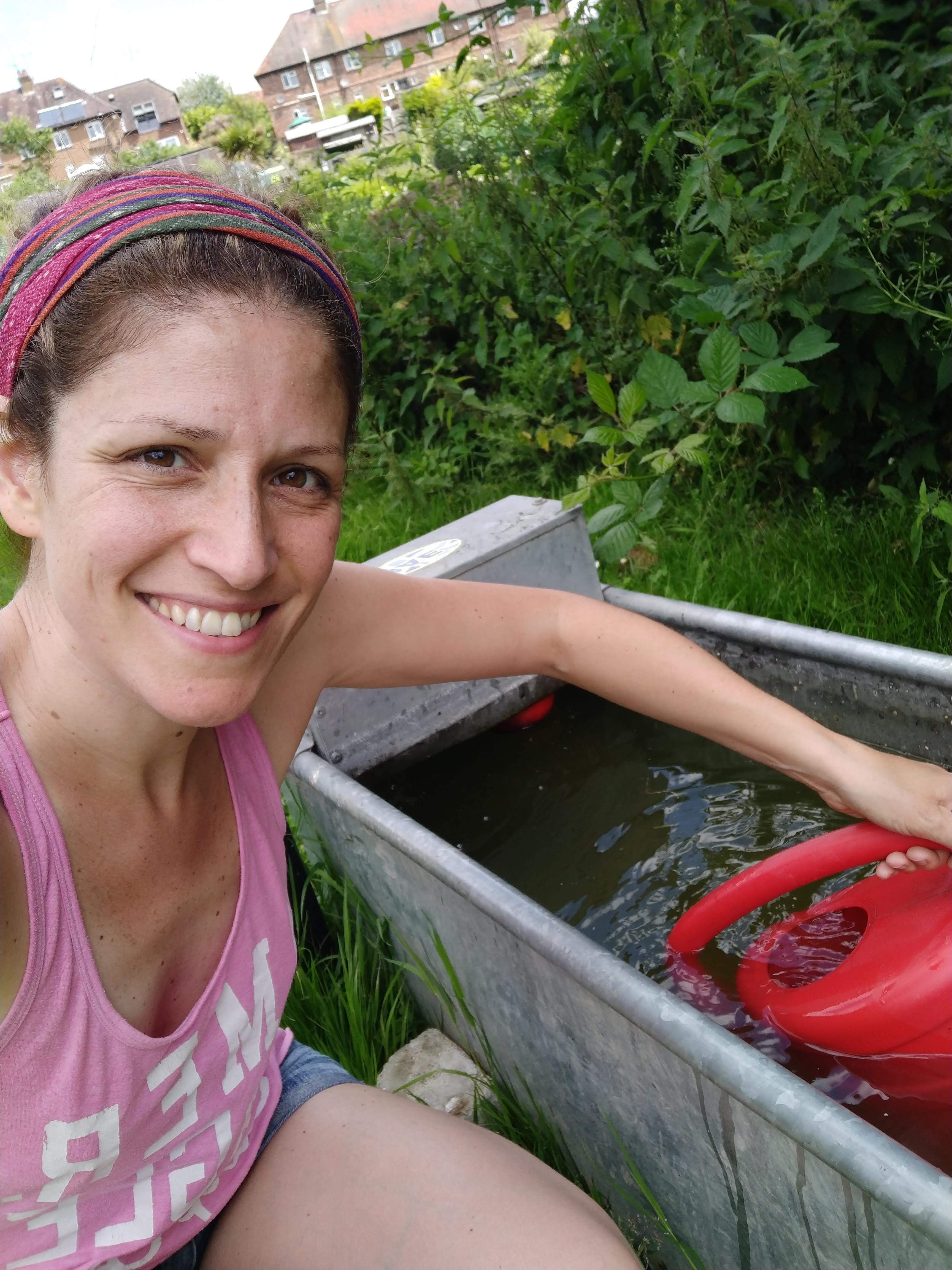 Anna in the allotment behind the house and near to the water plant