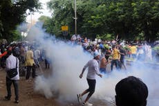 Protesters seize iconic Indian bridge in anti-government march after doctor’s death