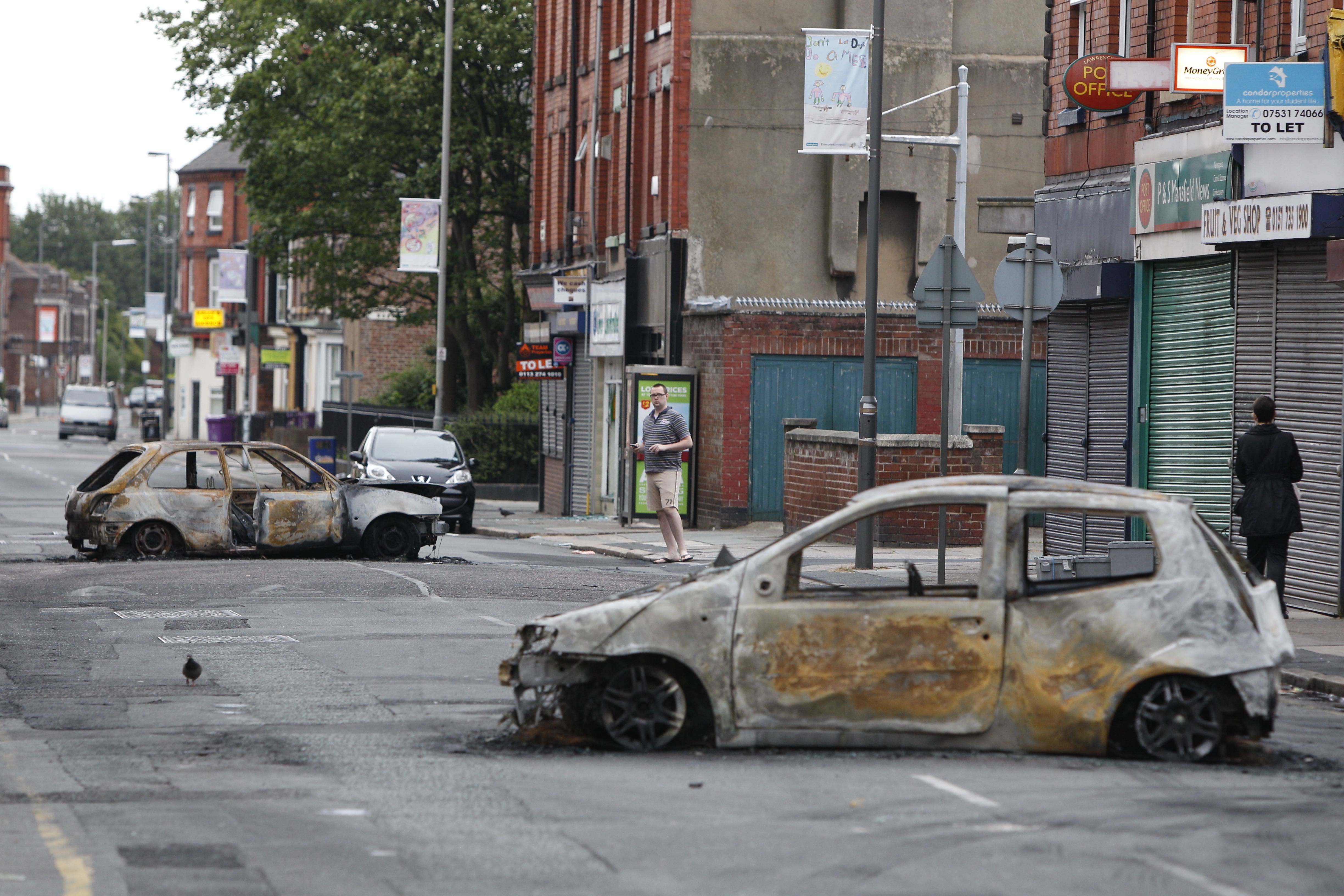 Burnt out cars in Toxteth, Liverpool, after rioting in the area (Peter Byrne/PA)