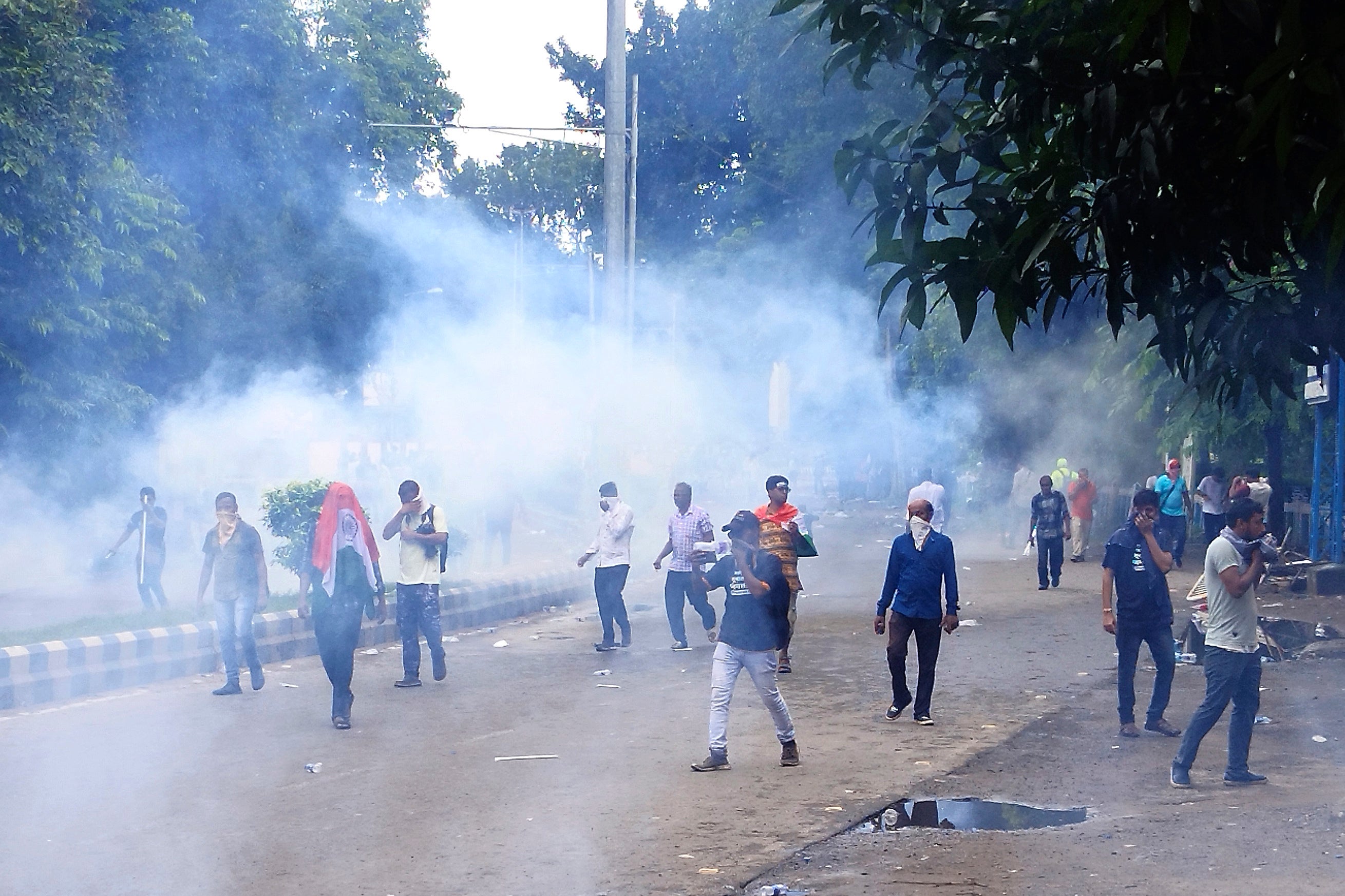 Police fire teargas to disperse people protesting against the rape and murder of a doctor in Kolkata