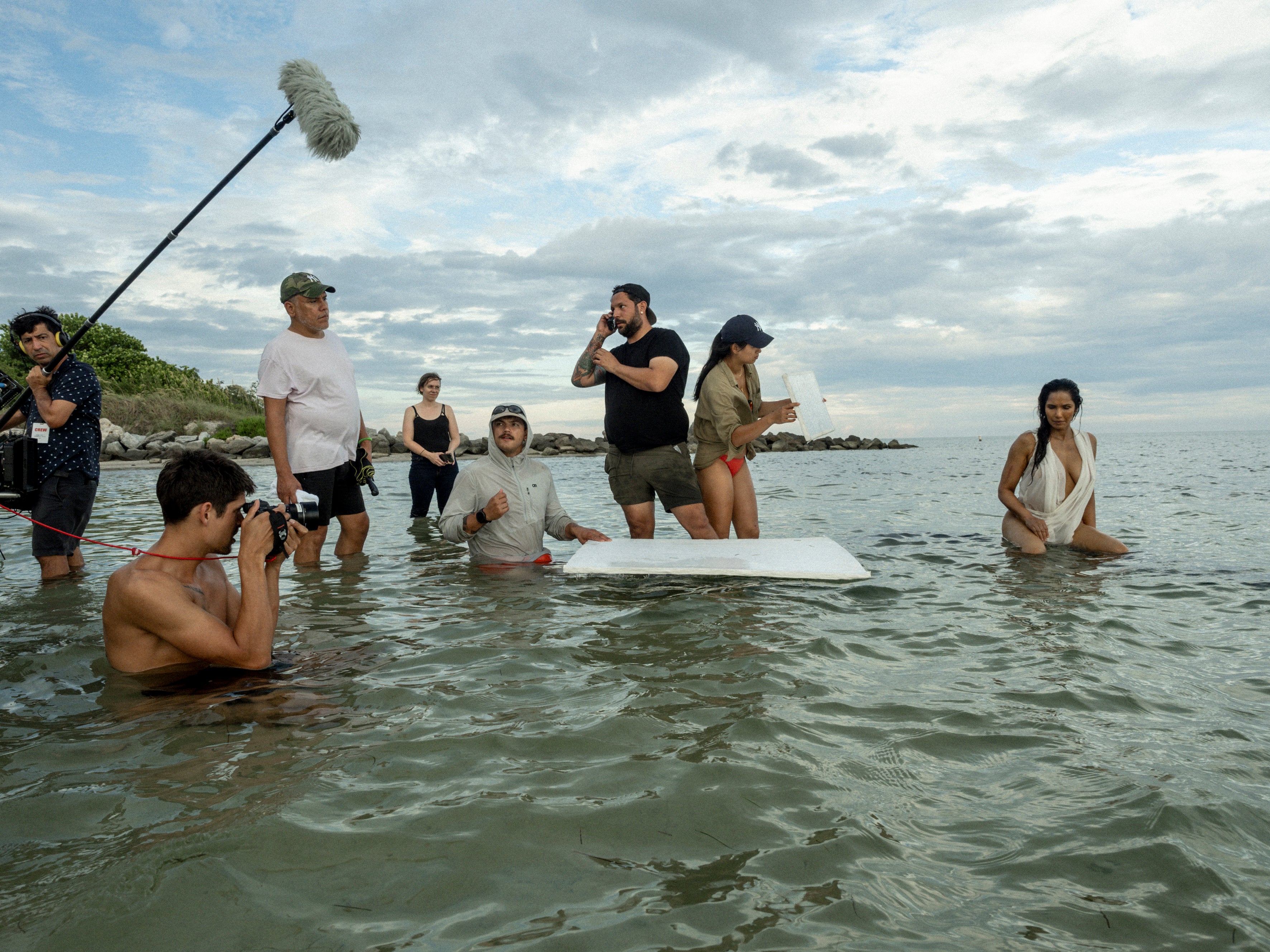 Padma Lakshmi sits in the water for her 2024 Pirelli Calendar shoot outside