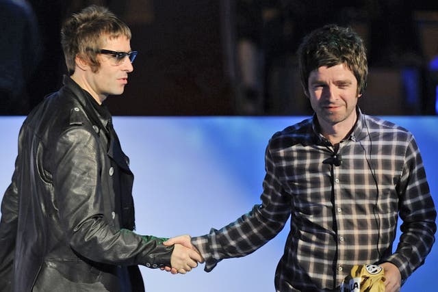 <p>Liam (left) and Noel on stage together in 2008</p>