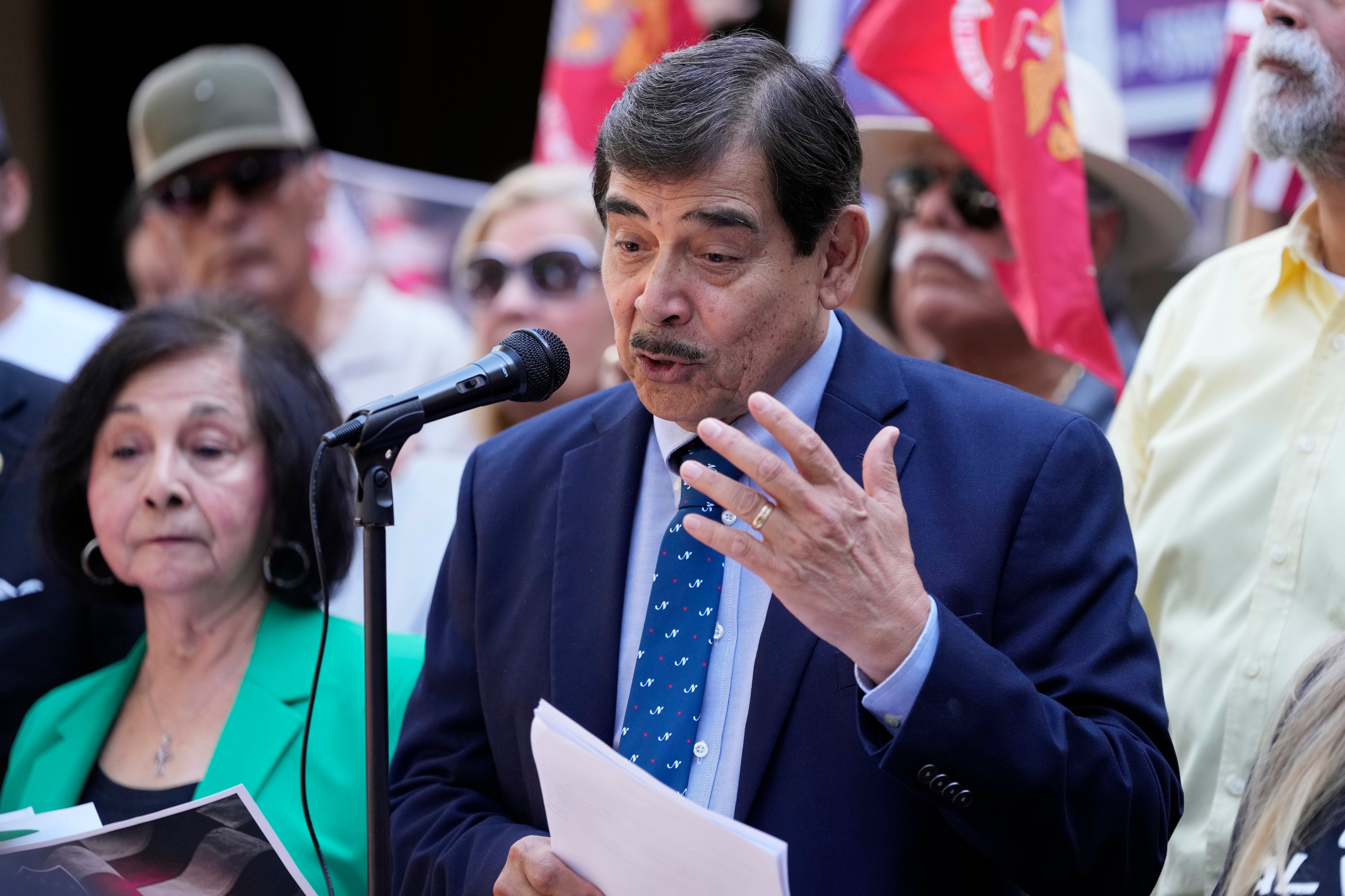 Roman Palomares, president of LULAC, condemns Ken Paxton at a news conference on Monday