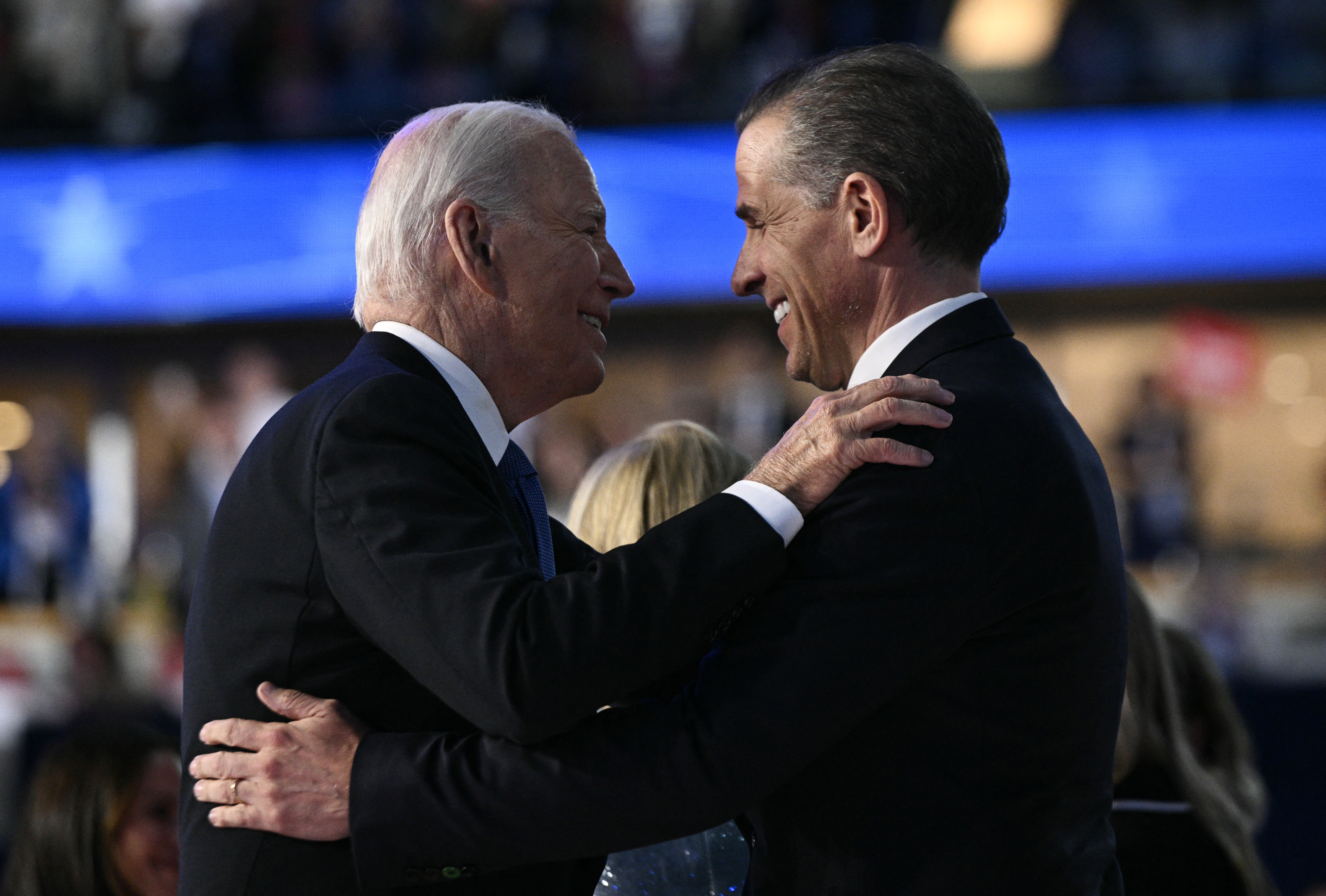 US President Joe Biden and his son Hunter Biden hug on stage at the conclusion of the first day of the Democratic National Convention (DNC) at the United Center in Chicago, Illinois, on August 19, 2024