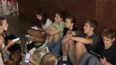 Kyiv residents sing city’s anthem while sheltering in subway during rocket attack