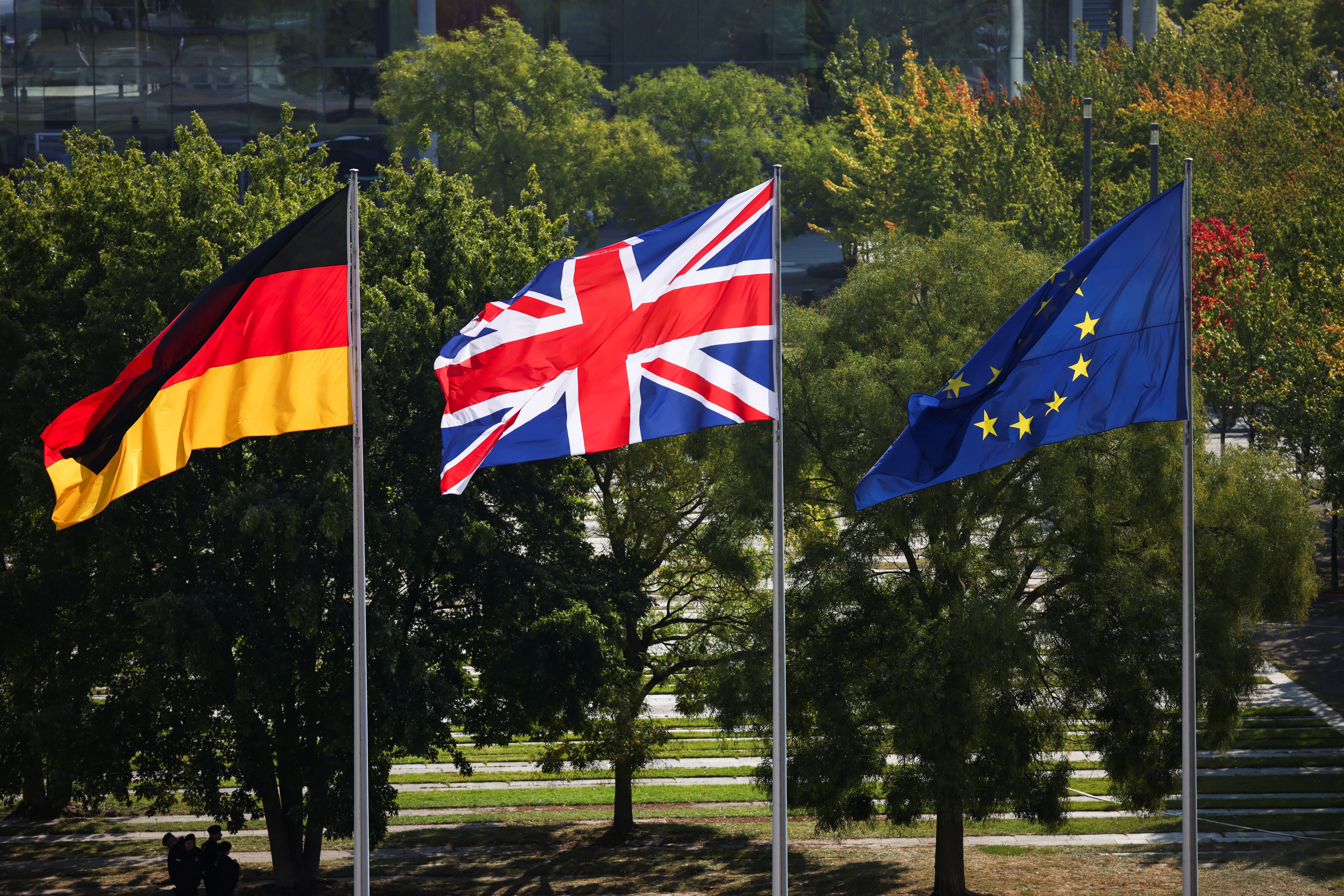 Flags of Britain, Germany and the EU flutter ahead of the arrival of Olaf Scholz and Keir Starmer in Berlin