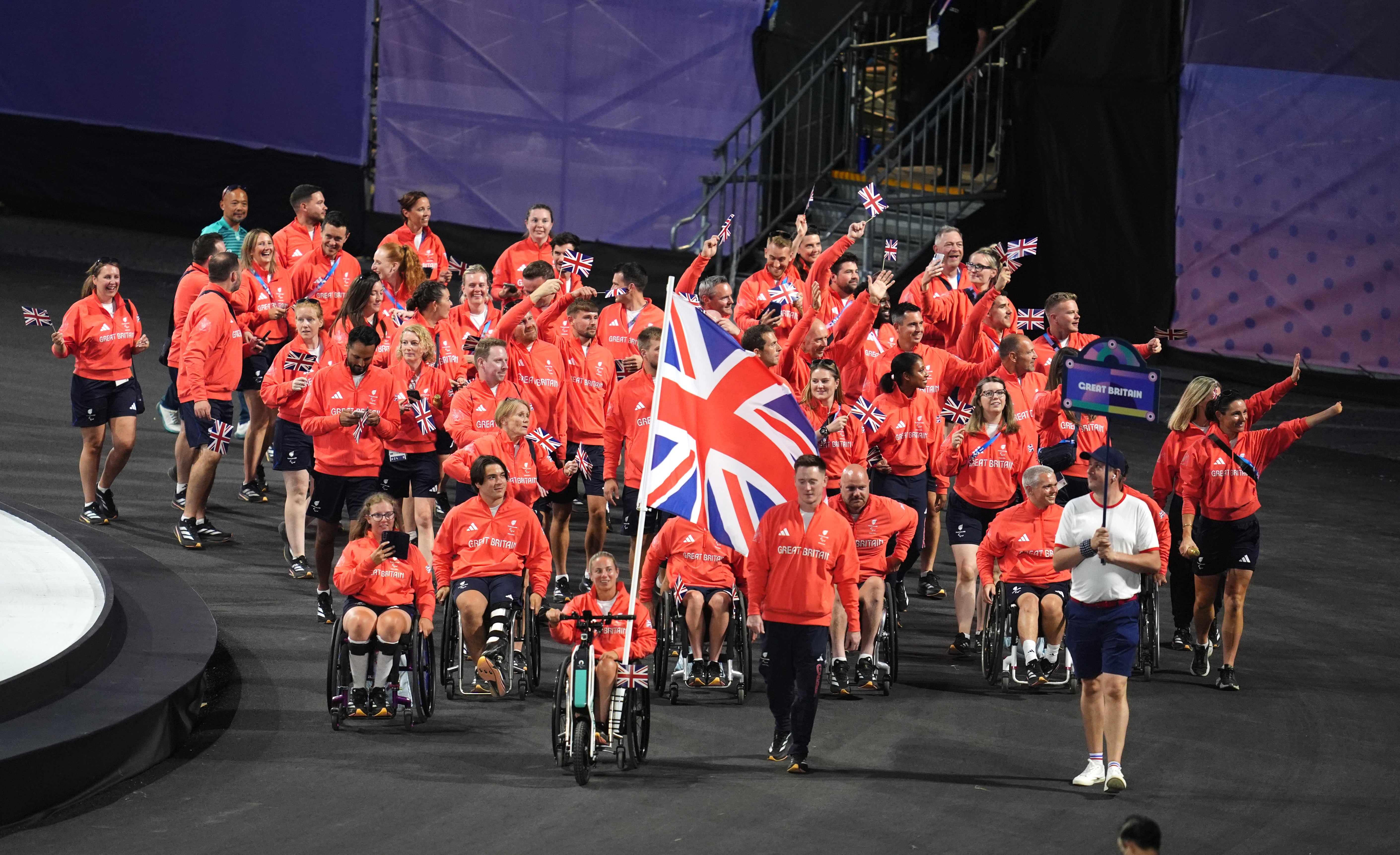 Flagbearers Lucy Shuker and Terry Bywater led ParalympicsGB into Place de la Concorde