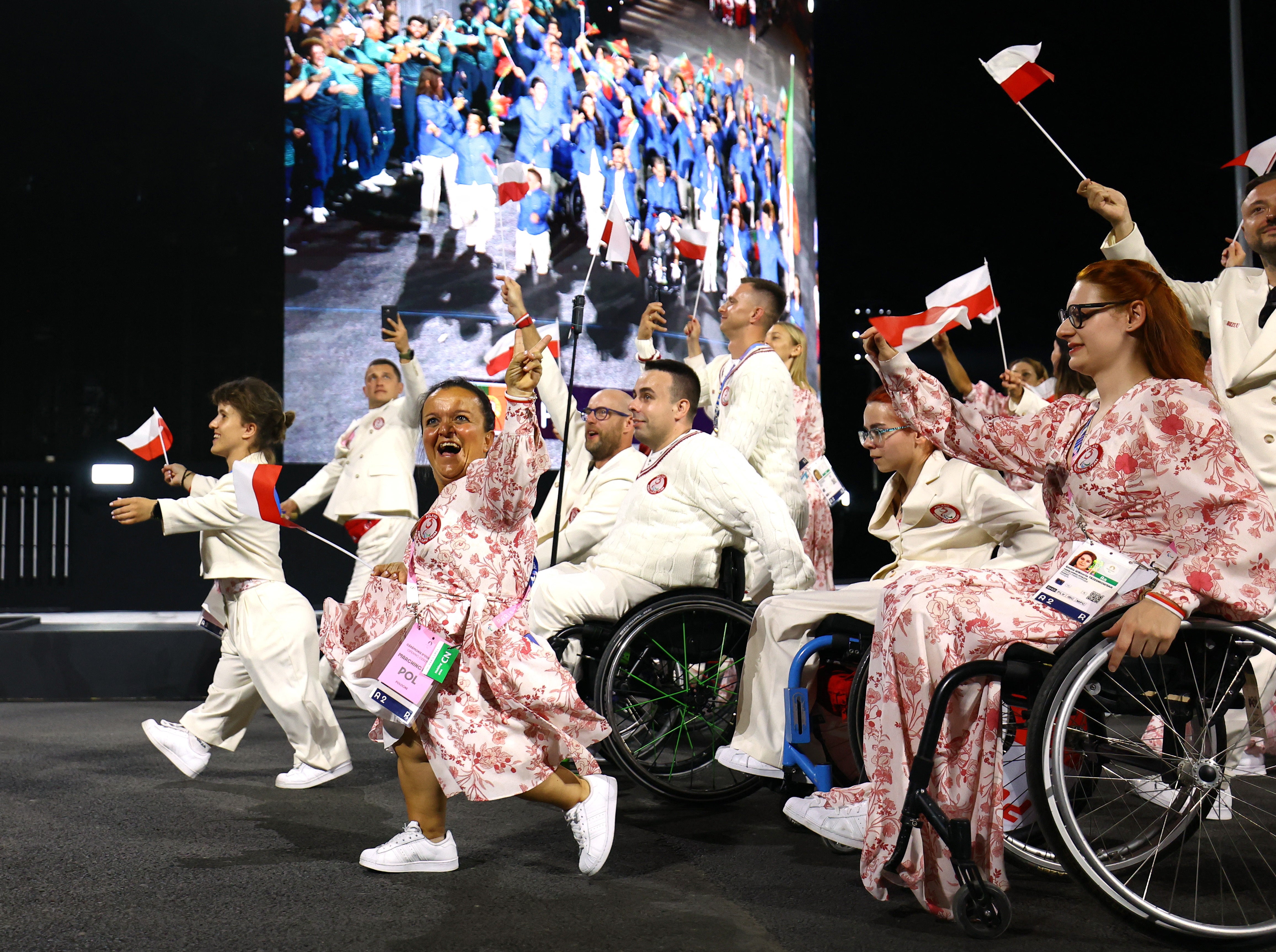 Polish athletes on the march down the Champs-Elysees as part of the Paralympics opening ceremony