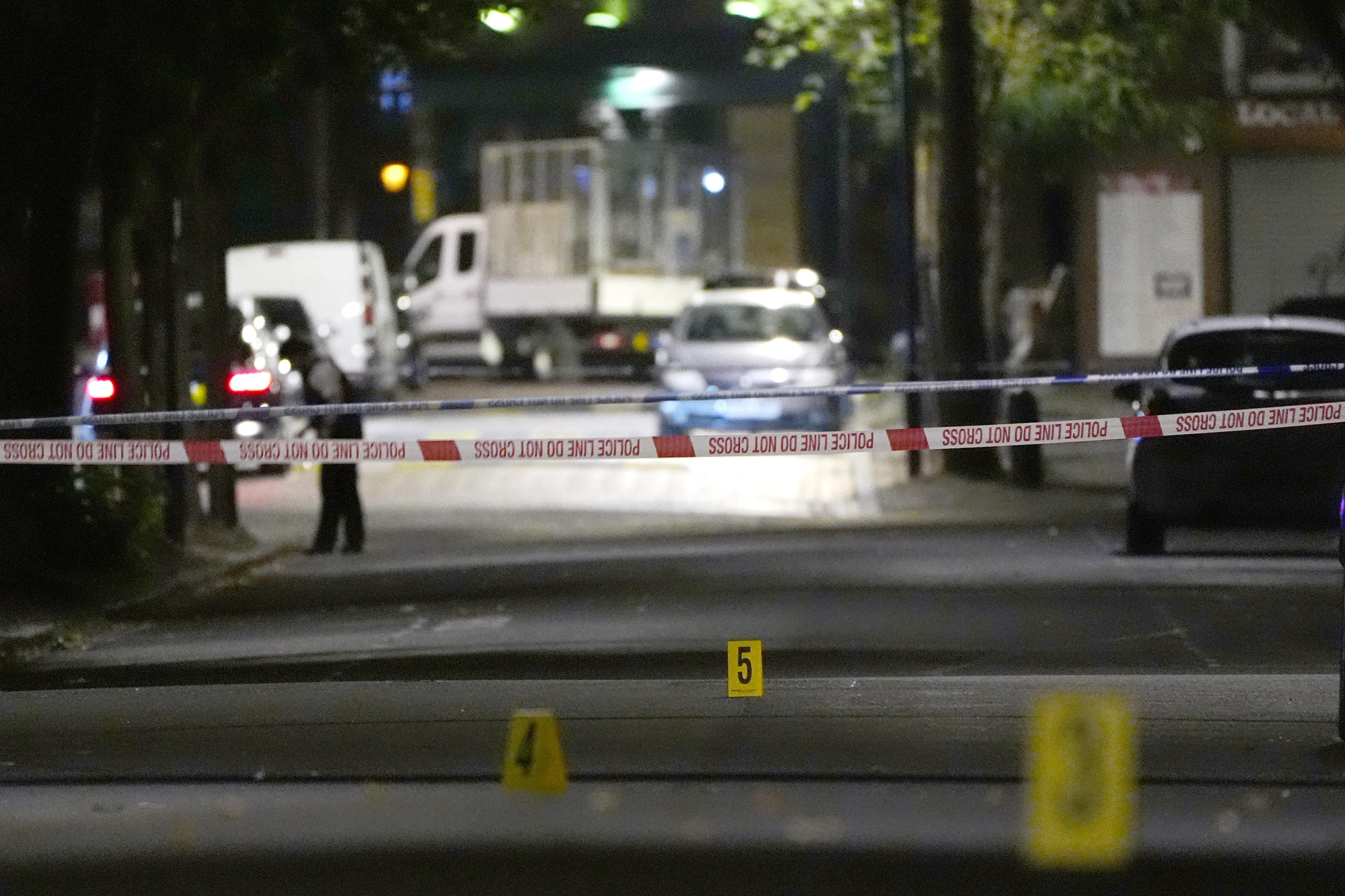 Crime scene markers on Overbury Street near the scene in Rushmore Road, Clapton.