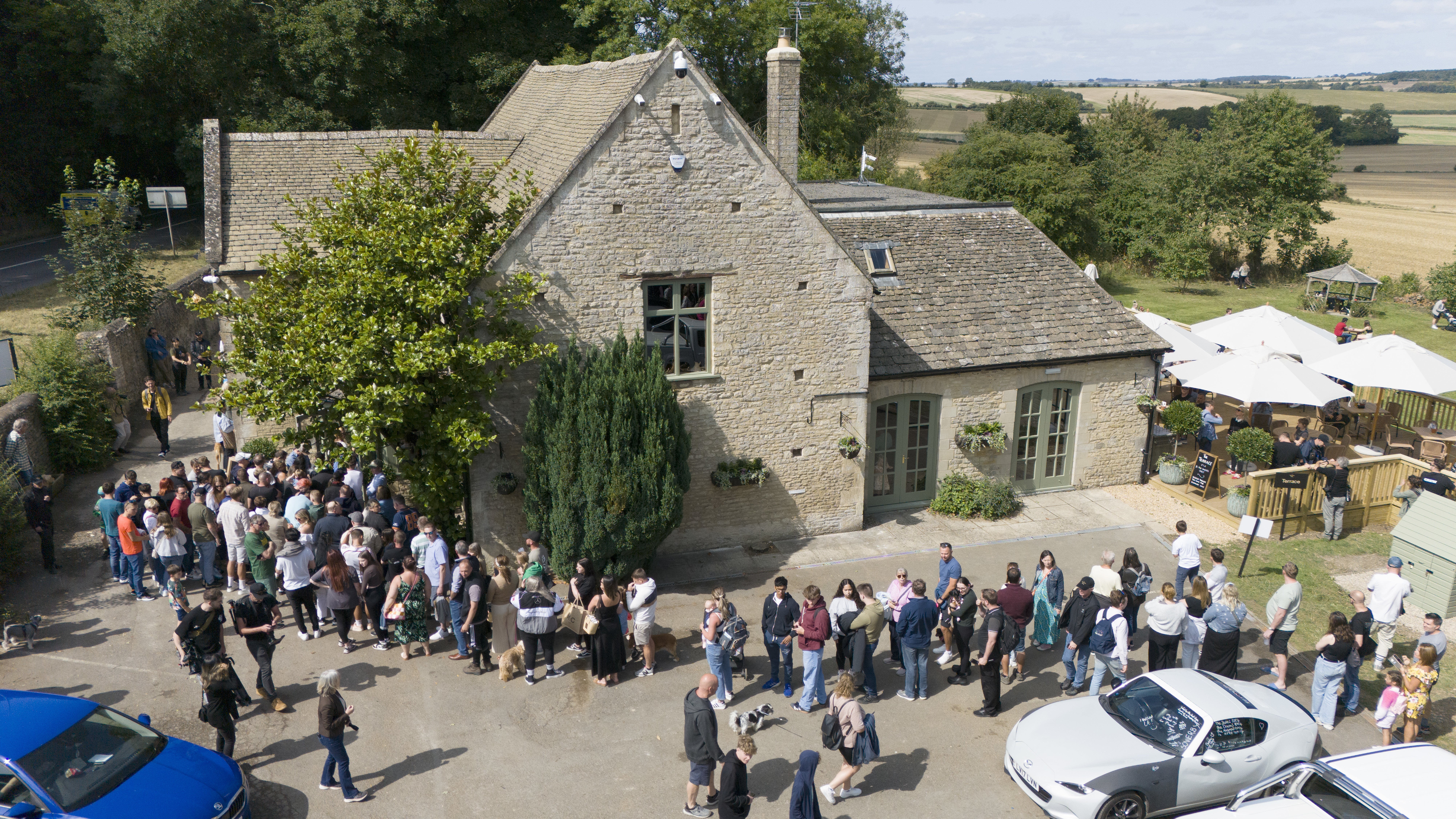 People queued outside The Farmer’s Dog on the day it reopened (Ben Birchall/PA)