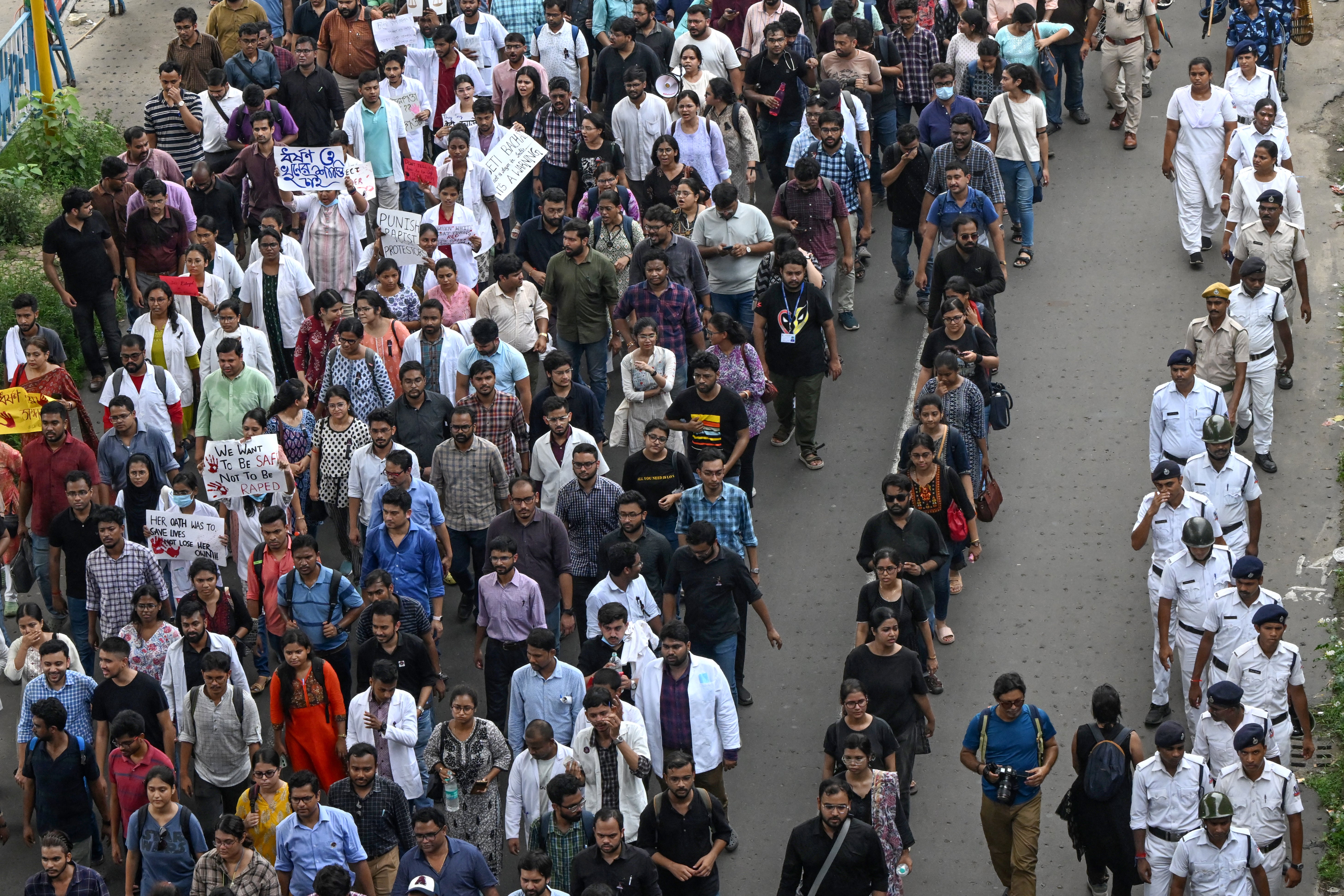 Medical professionals and students take part in a protest rally against the rape and murder of a doctor in Kolkata on 21 August 2024