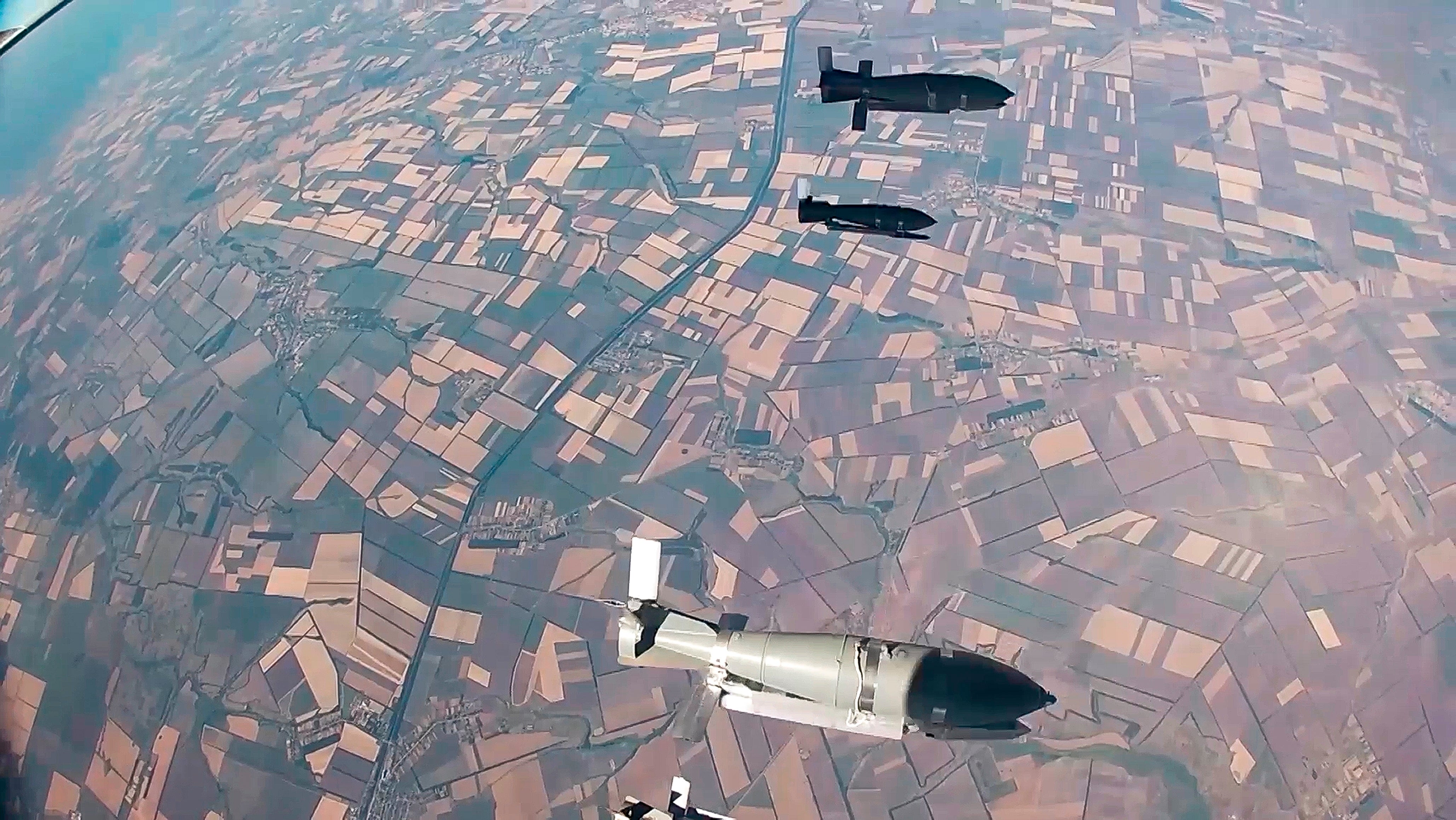 In this photo taken from video released by the Russian Defense Ministry on Aug. 21, 2024, glide bombs released by a Russian warplane are seen en route to targets amid an incursion by Ukrainian forces into Russia's Kursk region