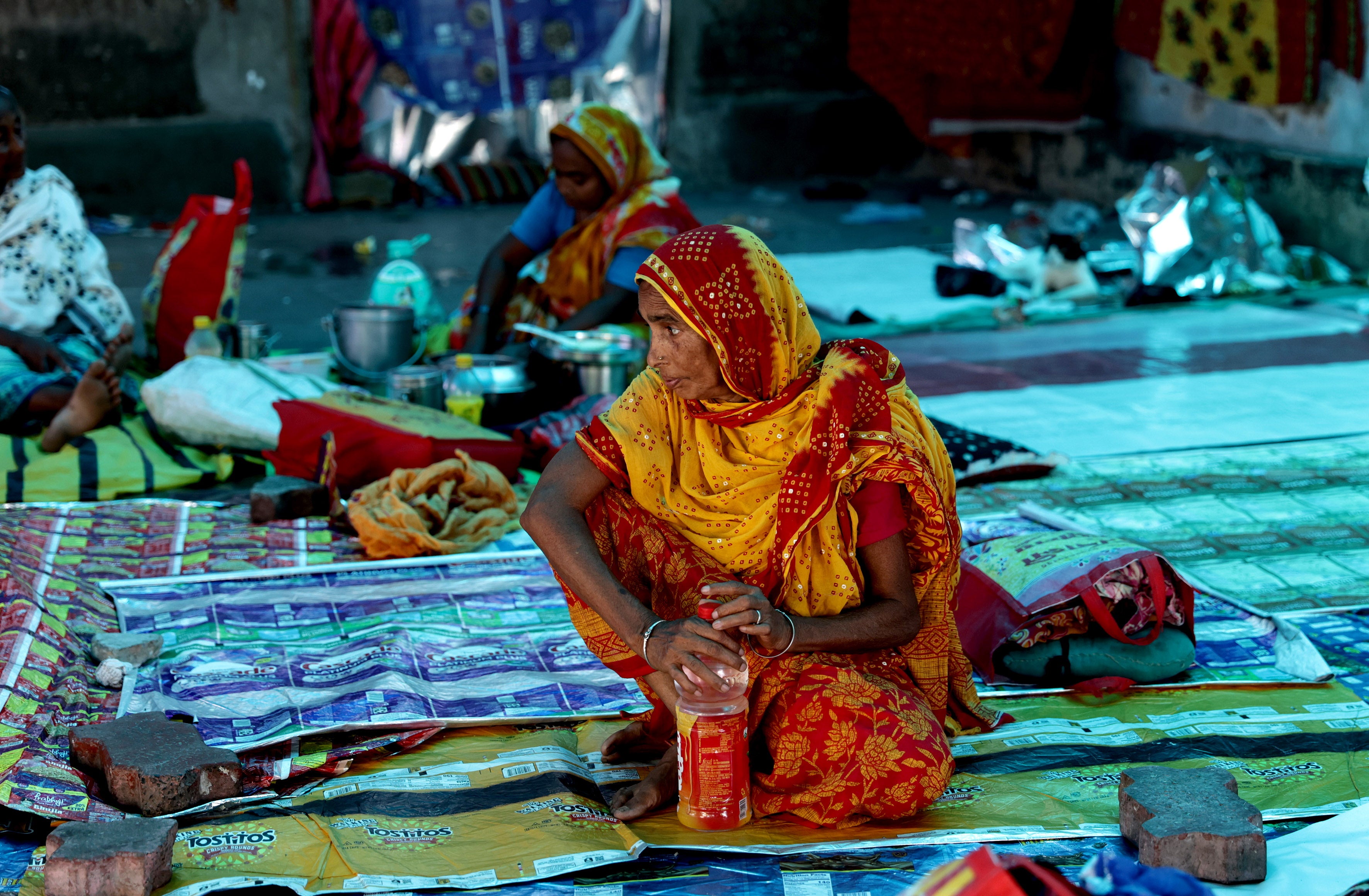 Relatives of patients wait as the medical students and doctors attend a protest in Kolkata, India, on 17 August 2024