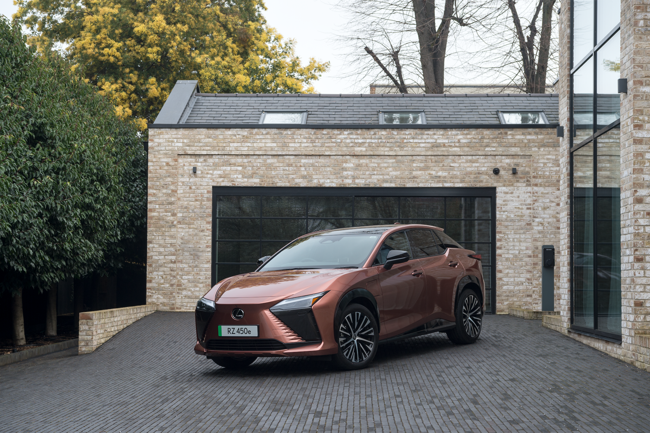 The Lexus RZ 450e electric car in takumi sonic copper