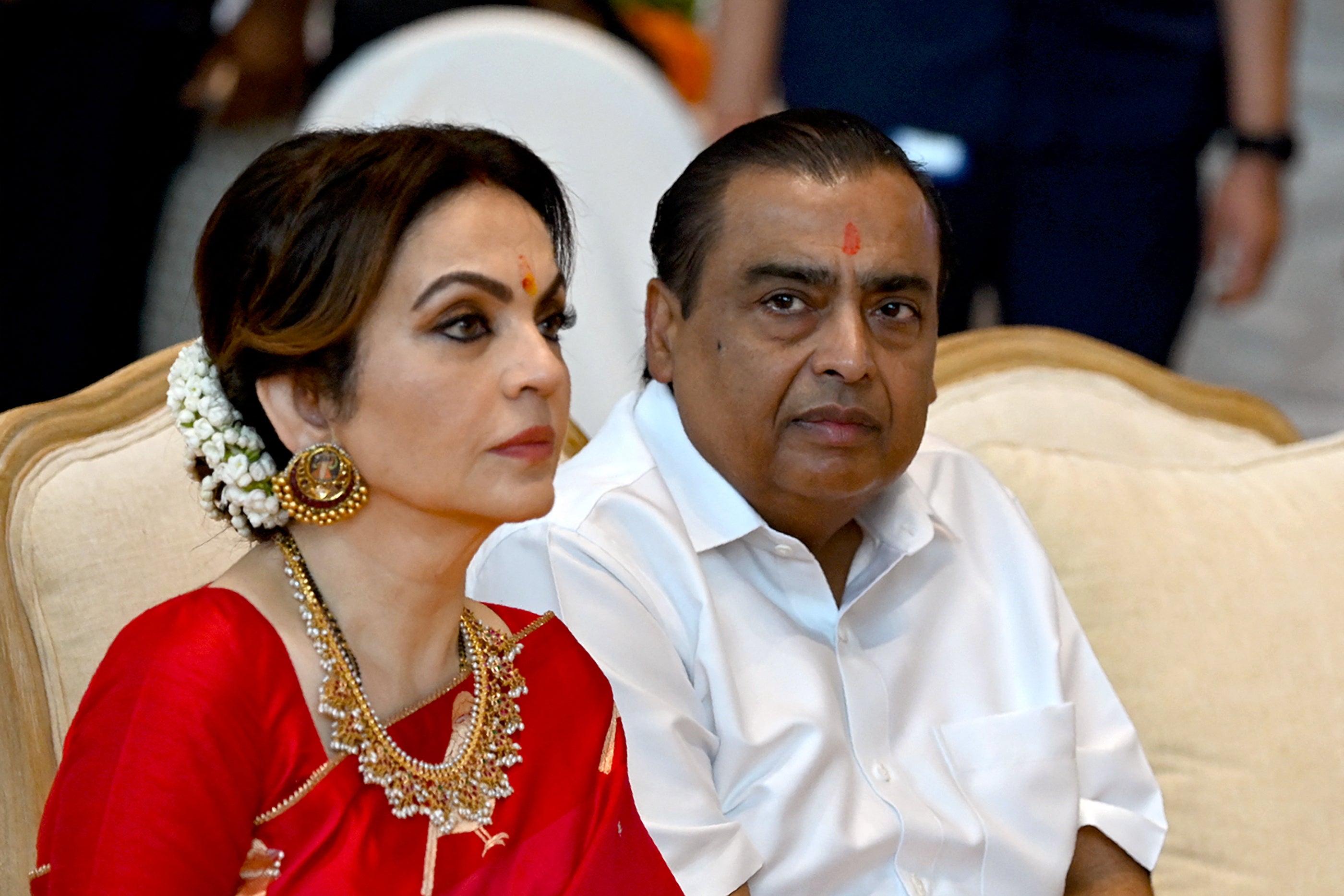 File. Billionaire tycoon and chairman of Reliance Industries Mukesh Ambani (R) with his wife Nita Ambani, who will reportedly oversee the merger between Disney and Reliance