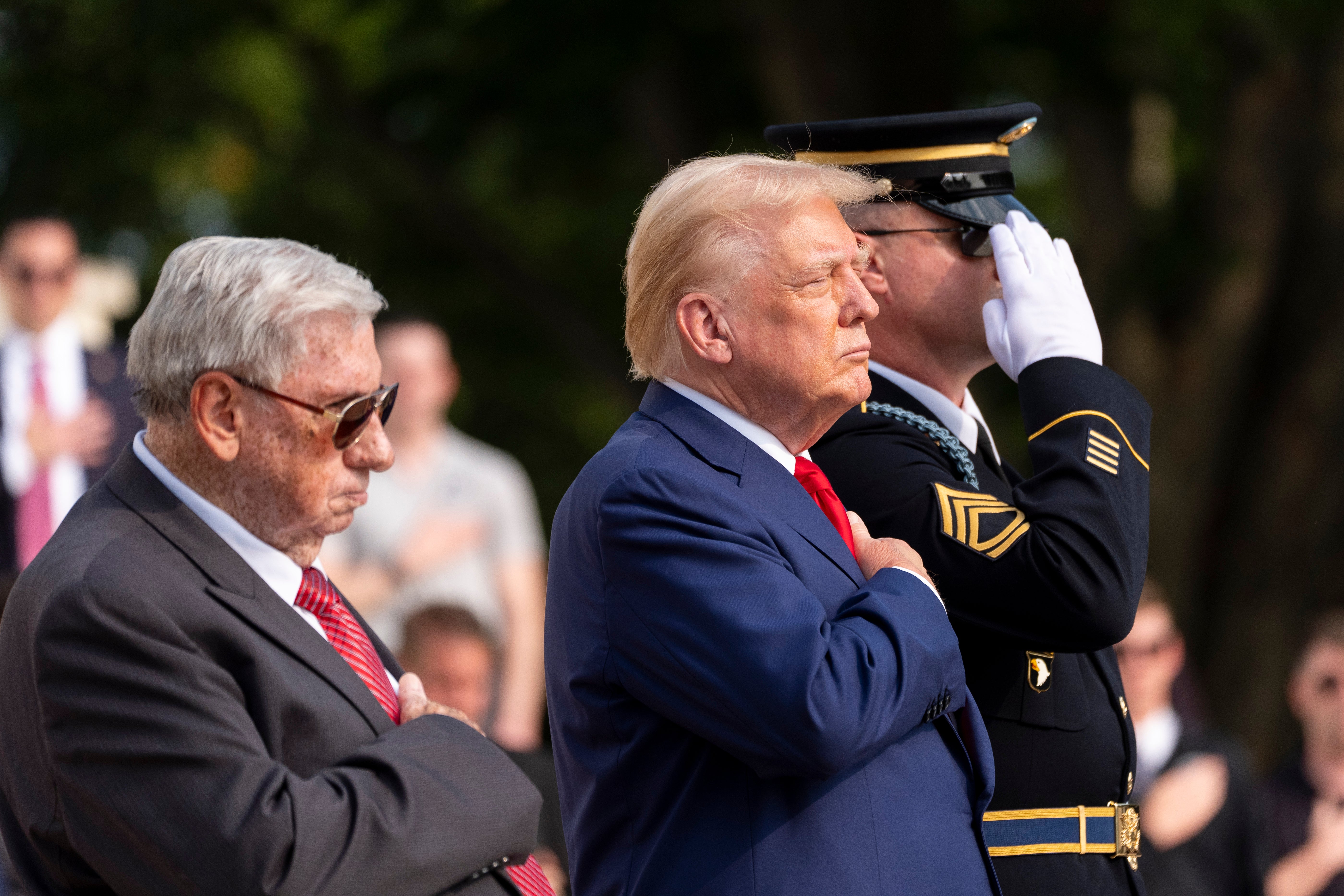 Trump attending a commemoration ceremony at the Arlington National Cemetery on Monday